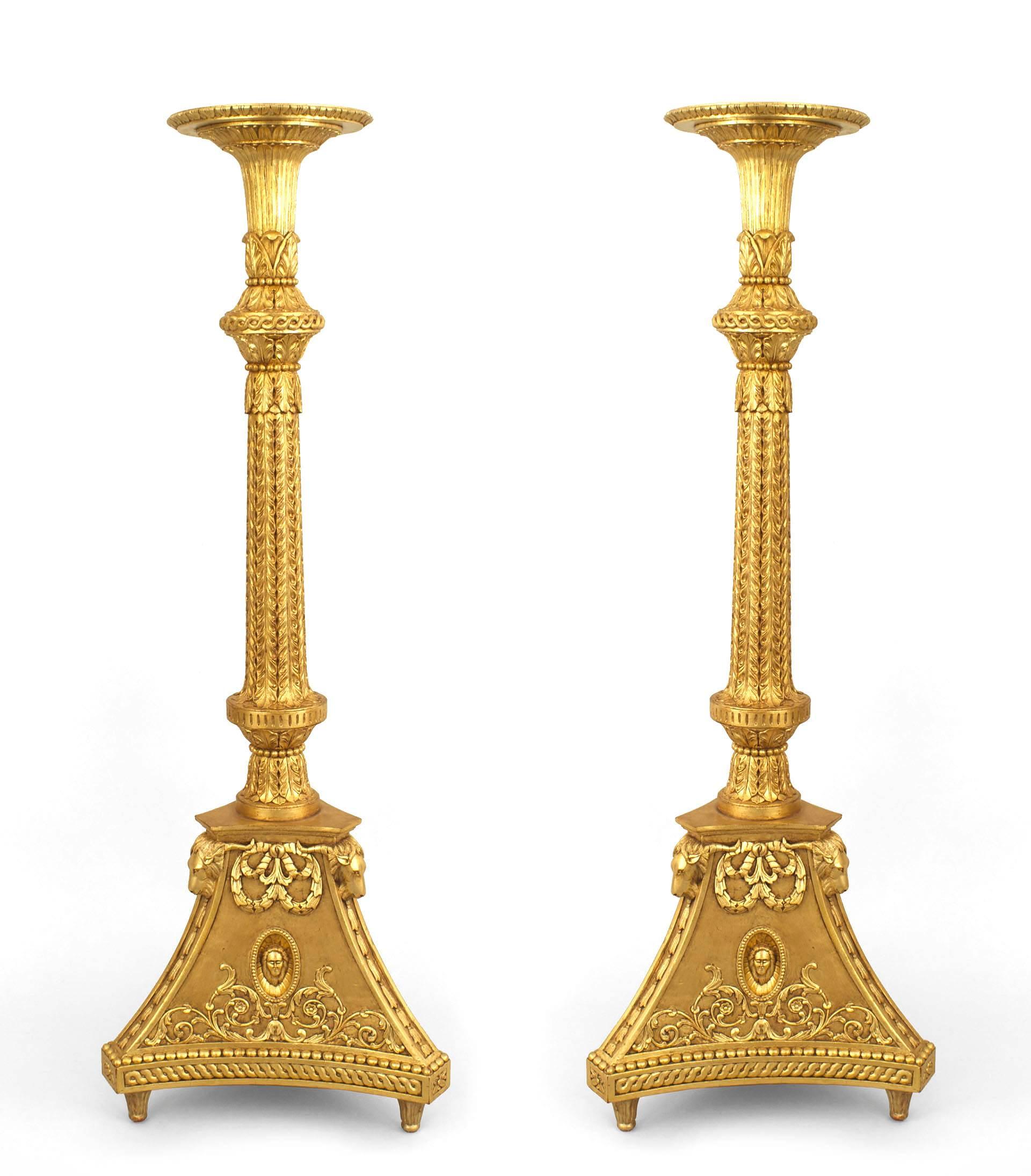 Pair of English Adam style (20th Cent) gilt wood carved pedestals having a solid triangular base.

