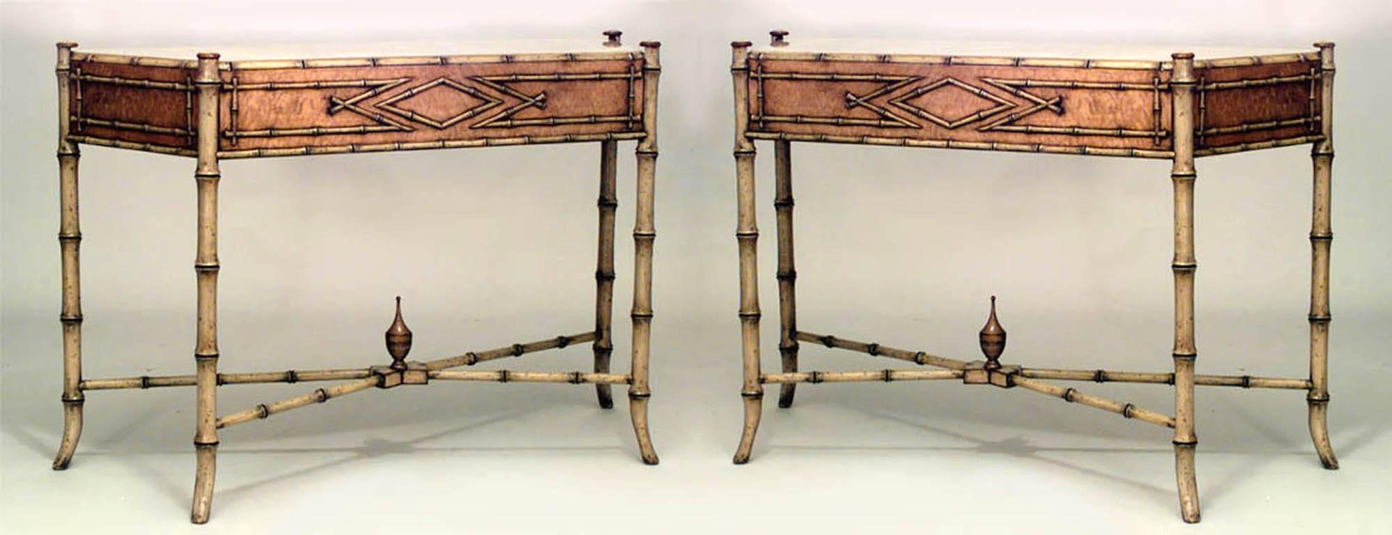 Pair of faux bamboo painted console tables crowned with an inset marble top and supported by four legs and an intersecting stretcher.