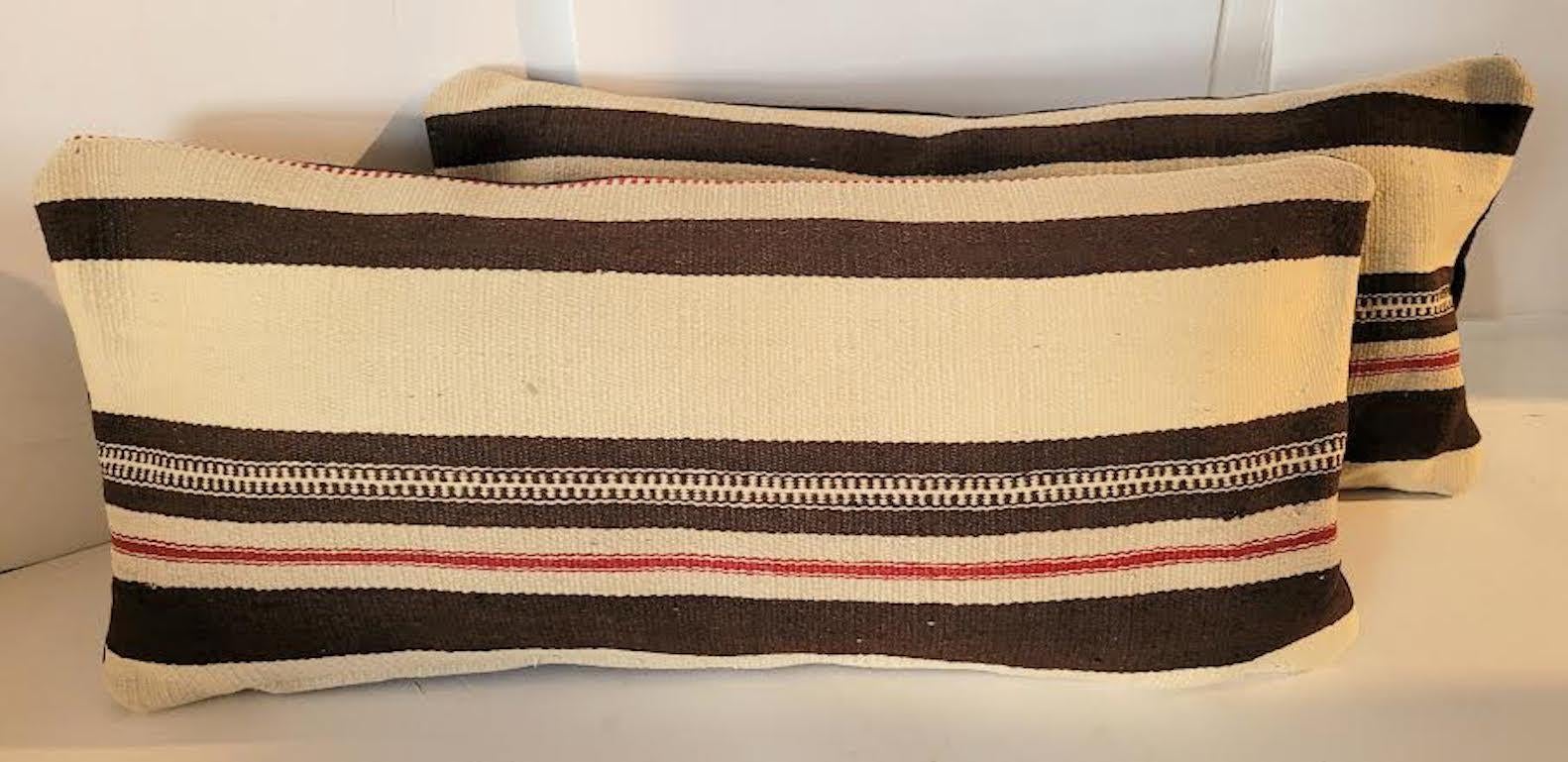 Pair of 20th C Mexican / American Texcoco Indian weaving bolster pillows.
Beautiful textured velvet backing and zippered casing. Feather and down insert.