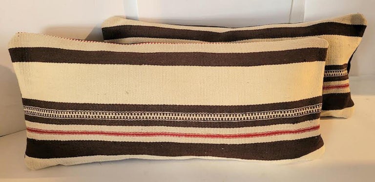Pair of 20th C Mexican / American Texcoco Indian weaving bolster pillows.
Beautiful textured velvet backing and zippered casing. Feather and down insert.