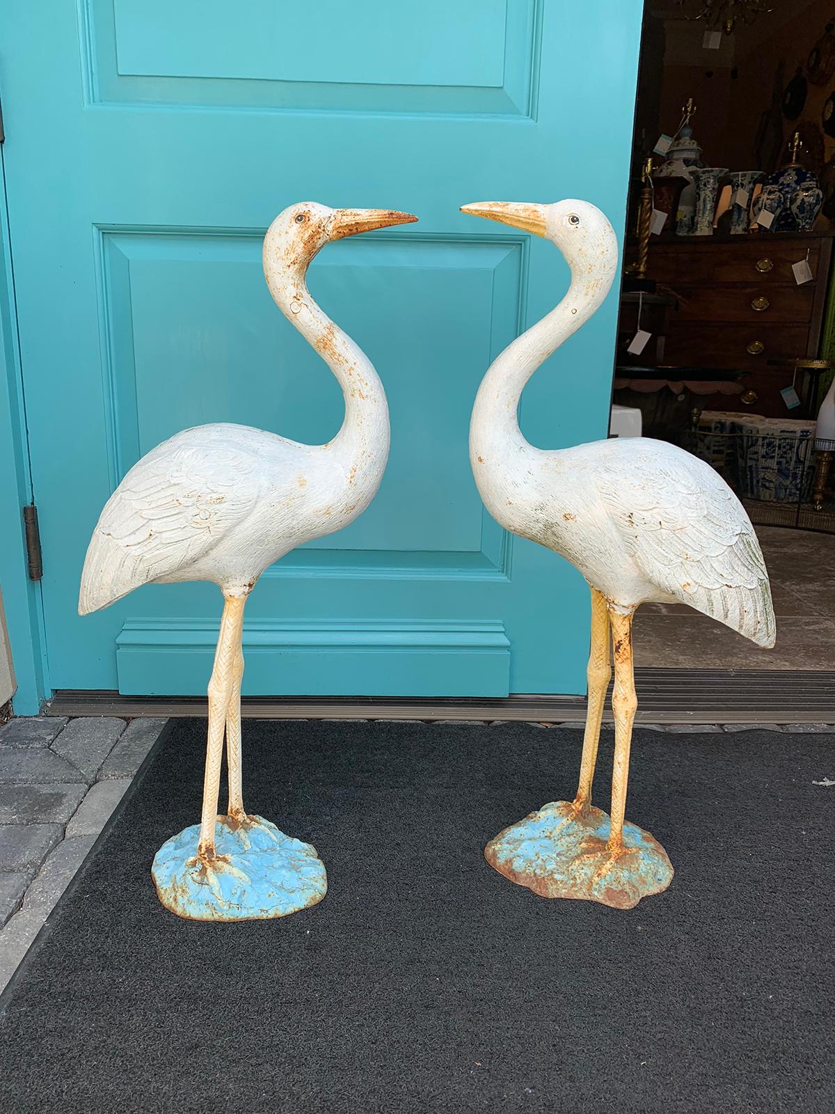 Pair of 20th century American cast iron garden cranes.