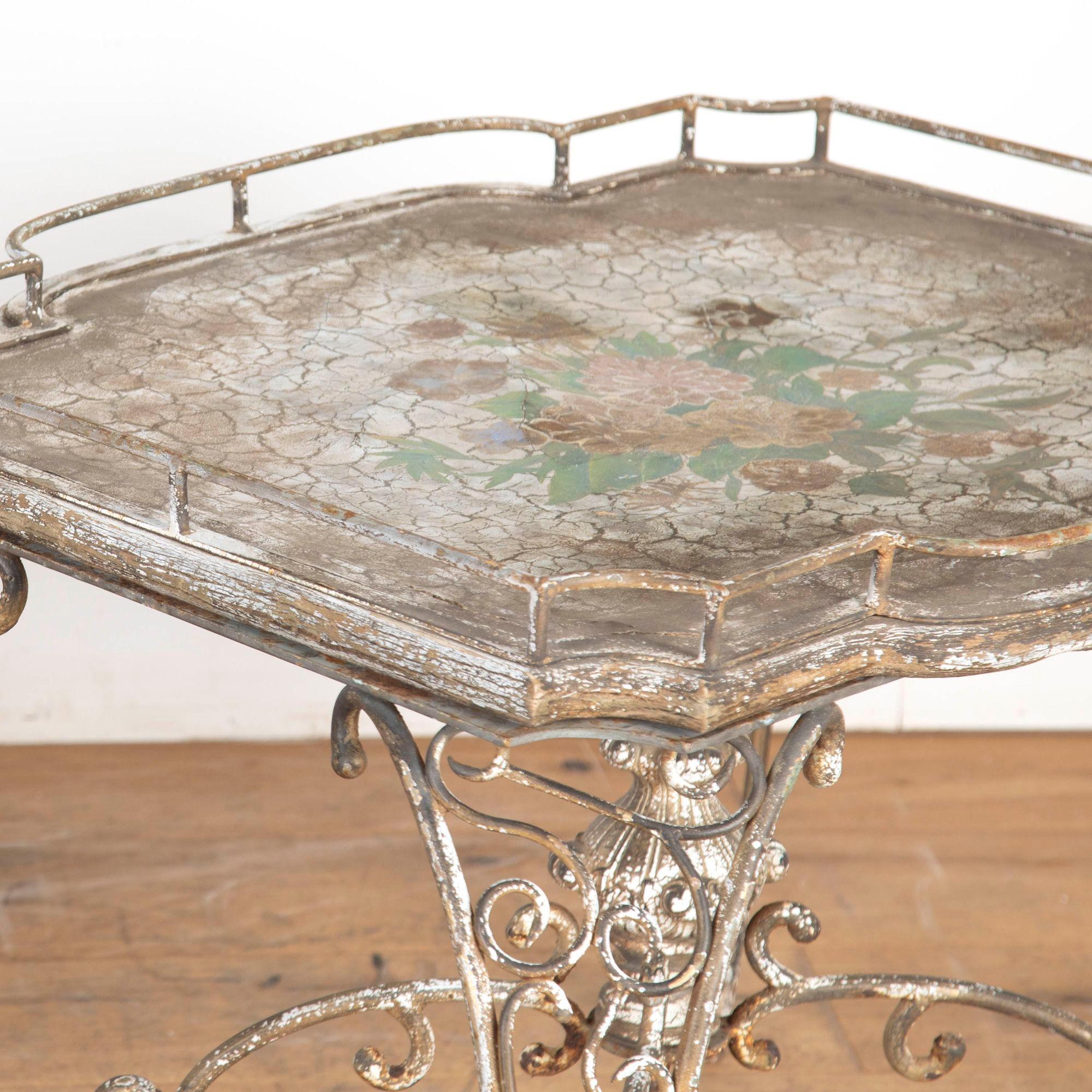Pair of 20th Century American iron and papier mâché conservatory tables.
In the Chippendale manner, this pair of side tables feature wonderful detailing.