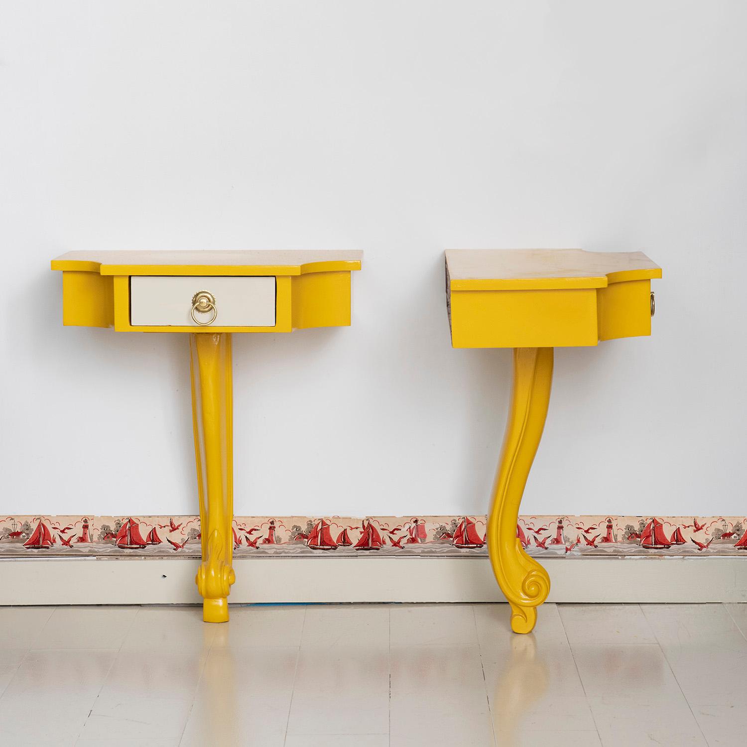 Pair of 20th century American console tables. Playfully reminiscent of Rococo and Renaissance style furniture, these tables are the product of 20th century American design innovation.
