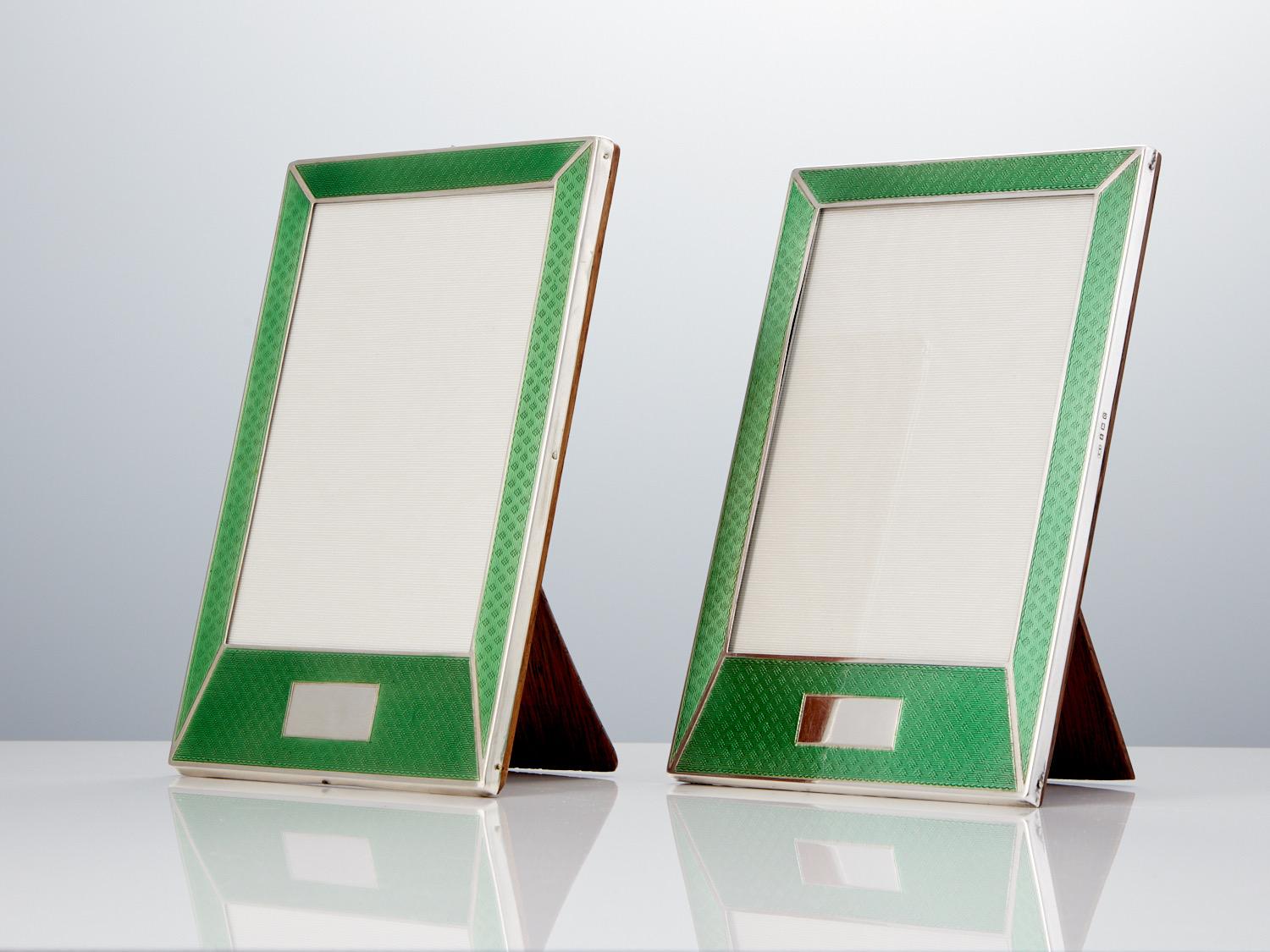 These beautiful English silver and guilloche enamel photo frames are in excellent condition and they retain their stunning translucent quality.
The backs are in original condition, there is a difference in easel supports but both are English