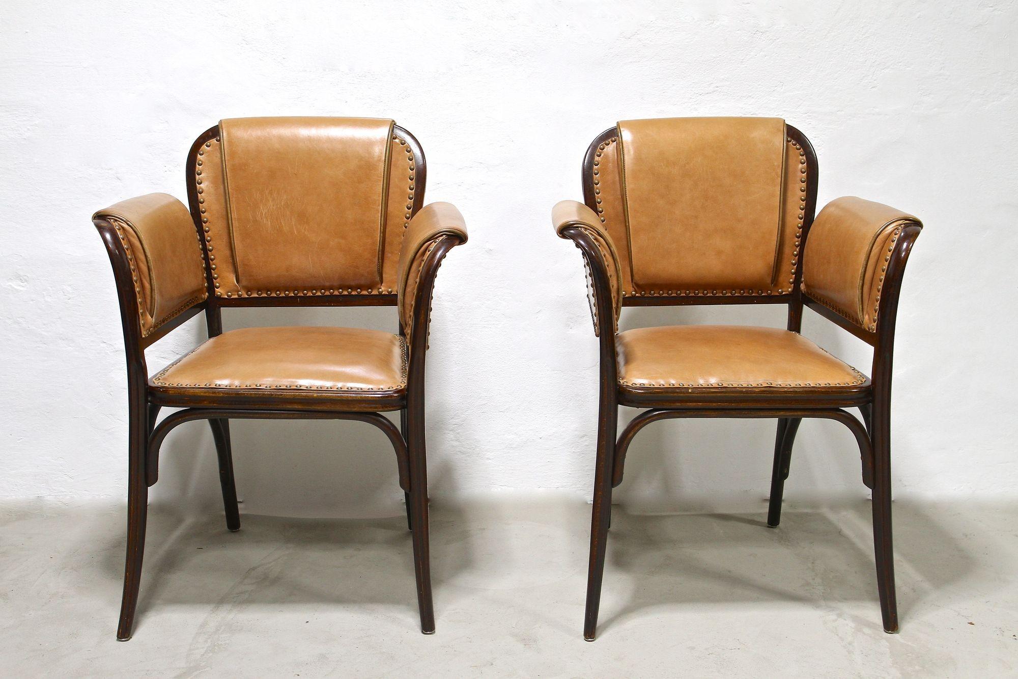 Absolutely rare pair of Art Nouveau bentwood armchairs from the period around 1904. Impressing with its amazing shaped lines, these elaborately crafted early 20th century armchairs were produced by the world renowed company of THONET Vienna - the