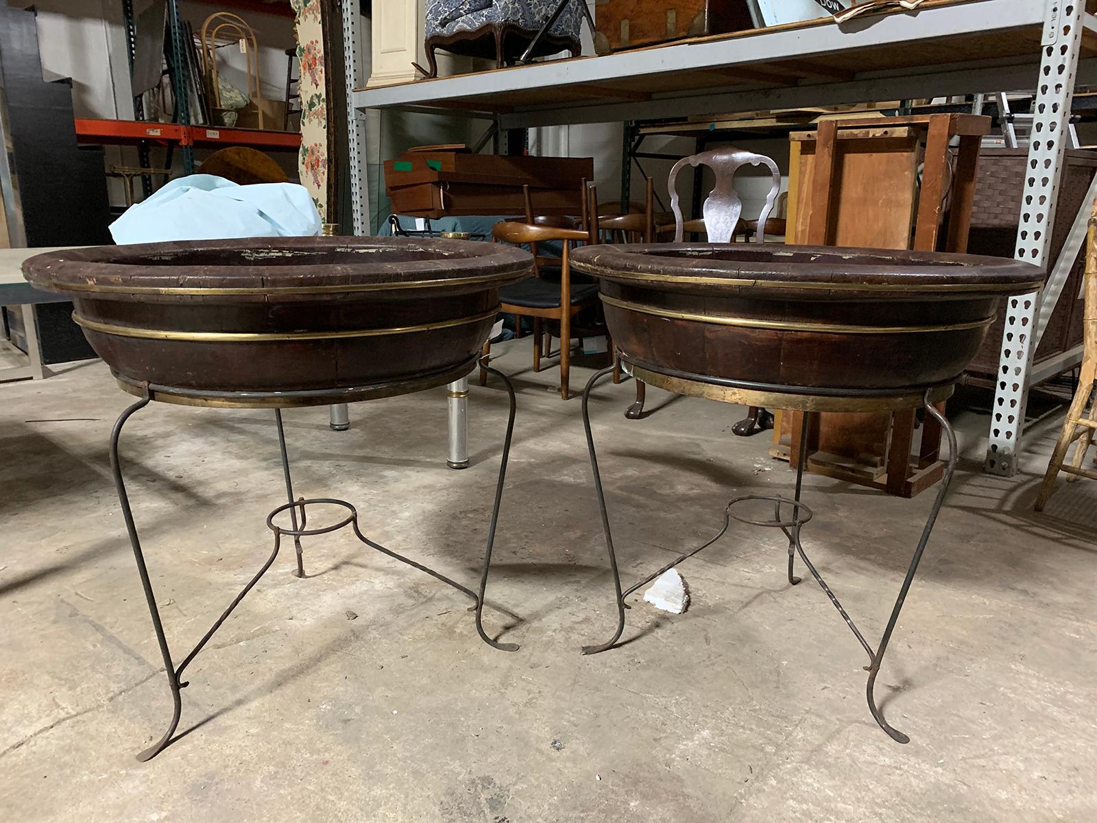 Large scale pair of 20th century Asian round wooden planters on custom metal stands
Measures: 31.5