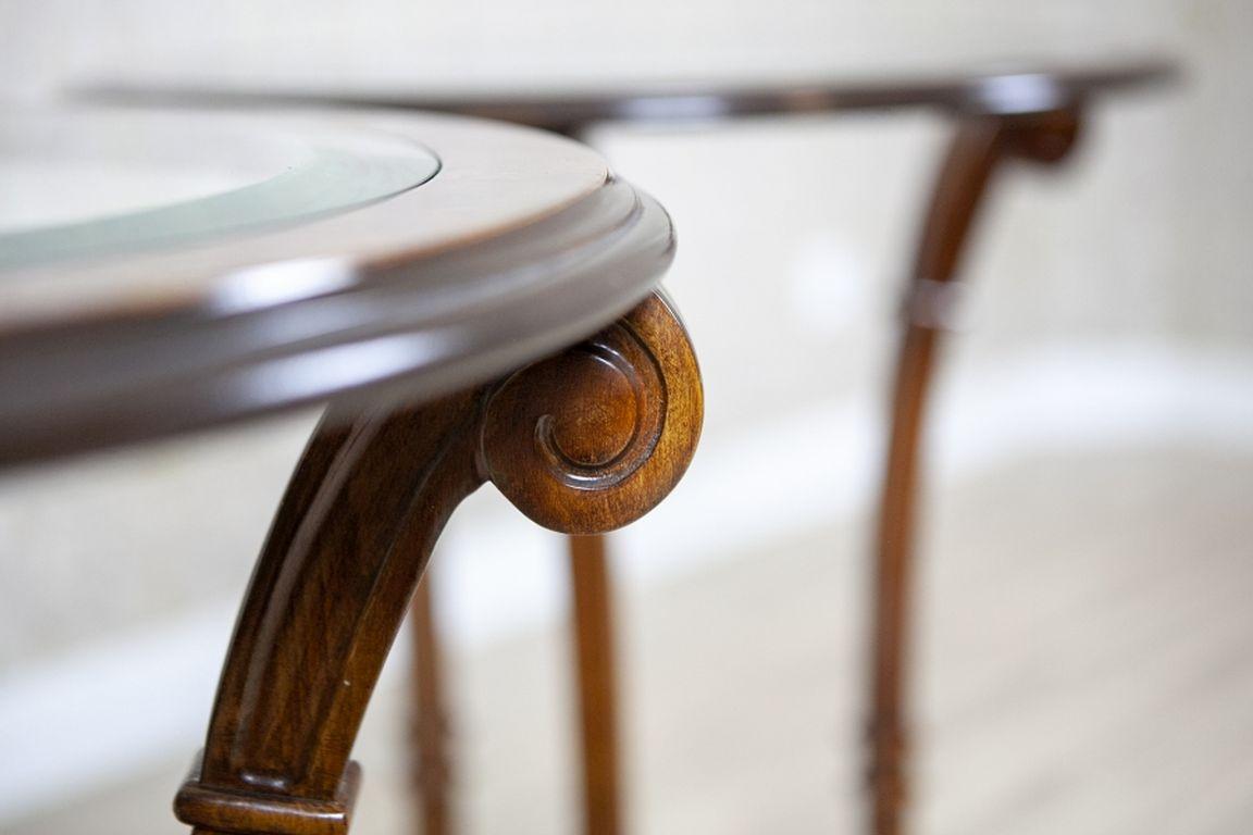 20th-Century Beech and Burlwood Round Side Table With Glass Top

(The price is for a single table.}

A round table with a glass top, dating back to the second half of the 20th century. The top is supported by three arched legs merging into a single