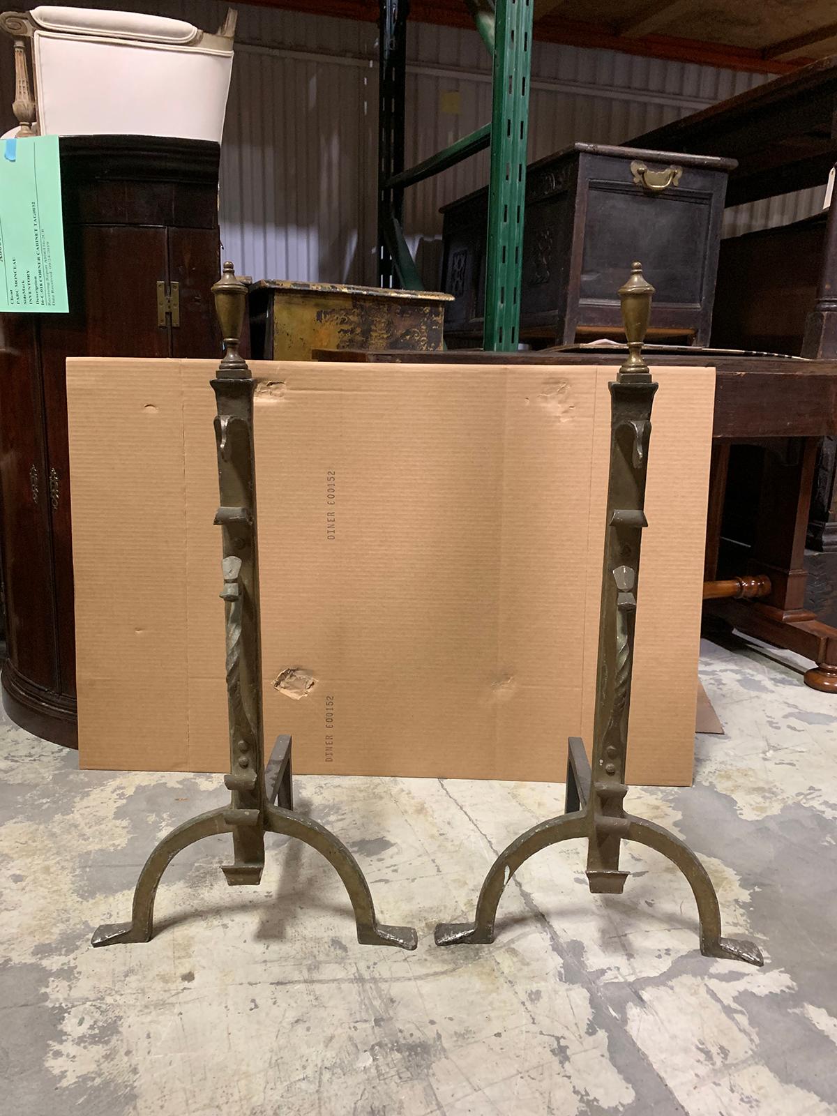 Pair of 20th century brass andirons with urn finial.