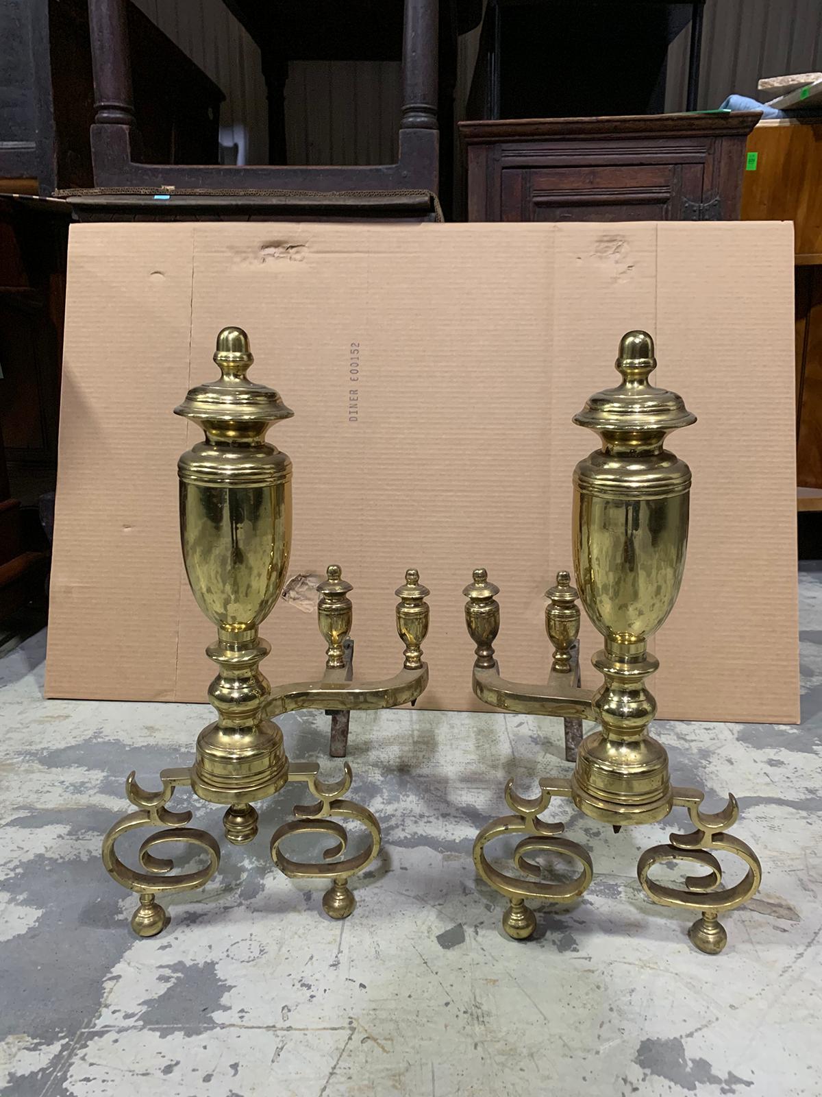 Pair of 20th century brass urn andirons with scrolled feet.