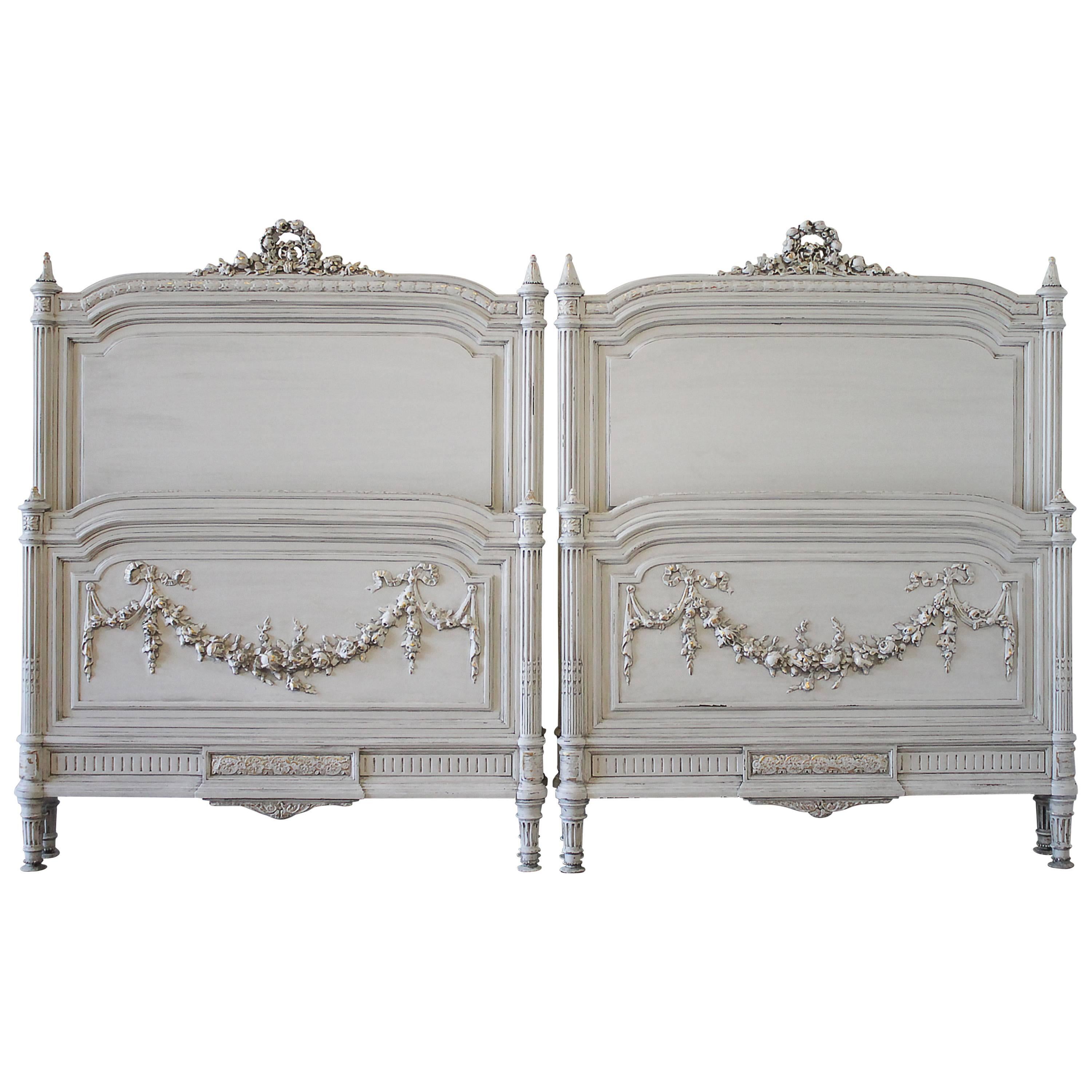 Pair of 20th Century Carved Painted Louis XVI Style French Beds with Rose Swags