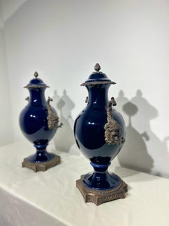 Pair of 20th Century China Urns with Bronze Mounted Handles Depicting Bacchus