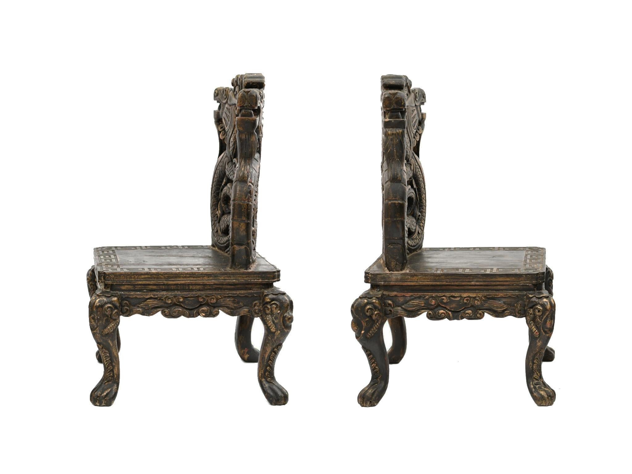 Pair of 20th Century Chinese Carved Side Chairs with Dragon Design In Good Condition In New York, NY