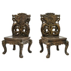Pair of 20th Century Chinese Carved Side Chairs with Dragon Design