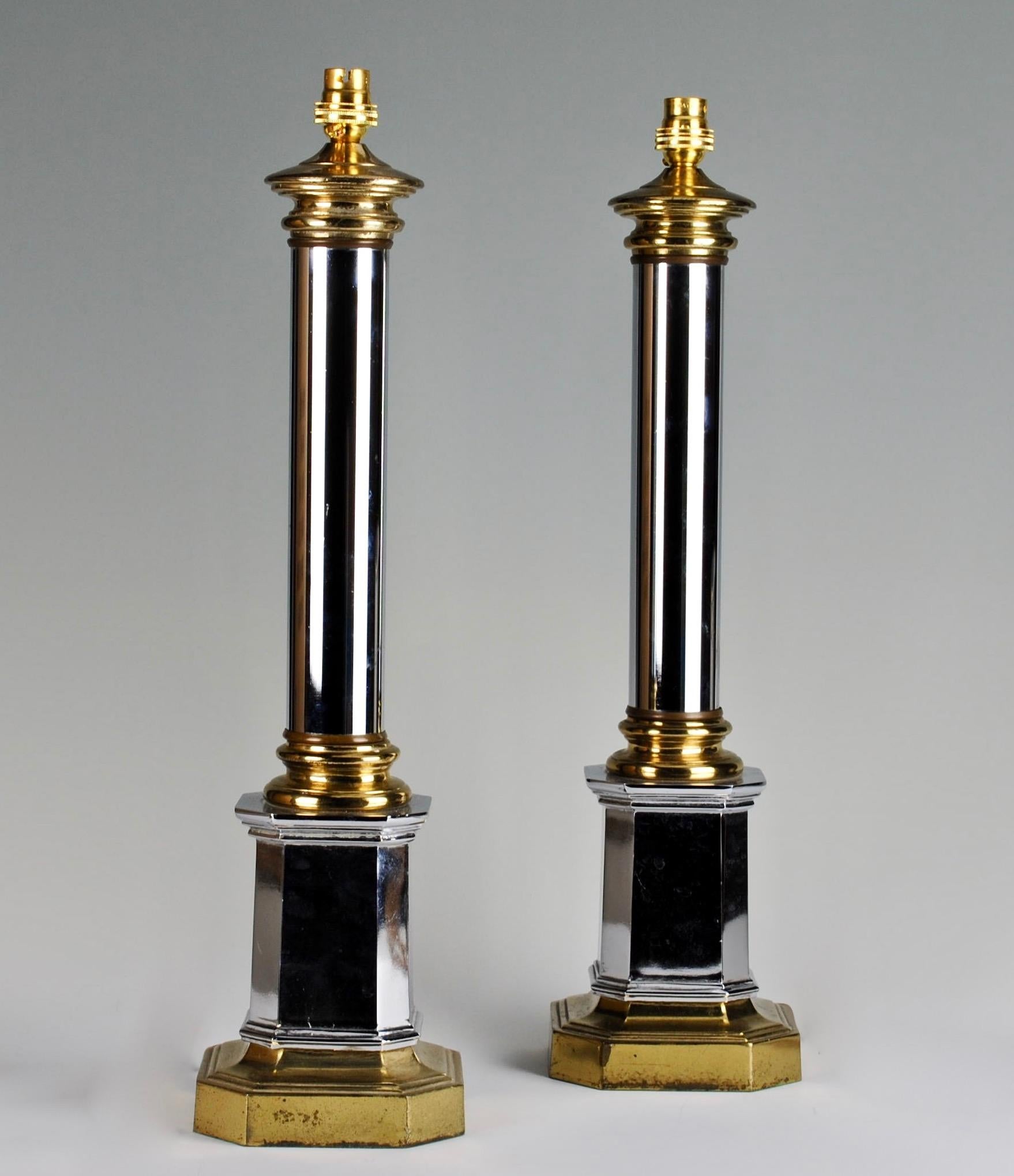 A fine pair of neoclassical chrome and silvered metal column lamps, on stepped octagonal bases.

Measures: Height 28 1/4 in (72 cm) excluding lampshade.

All of our lamps can be wired for use worldwide. We can supply a selection of card, linen