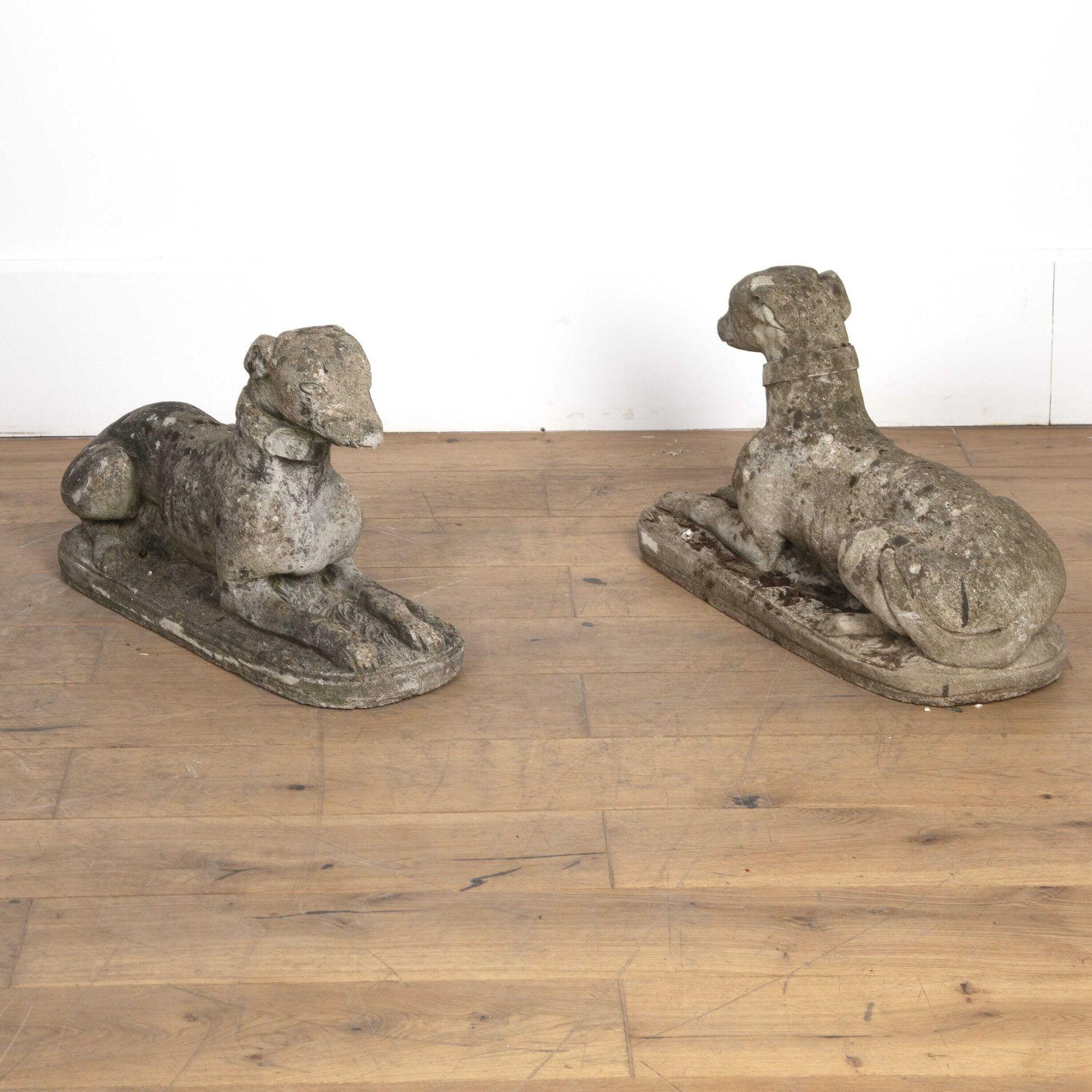 Good pair of composition stone recumbent whippets with a pleasing weathered patina. 
Of great size and detail, these statues would look great both indoors and outdoors.