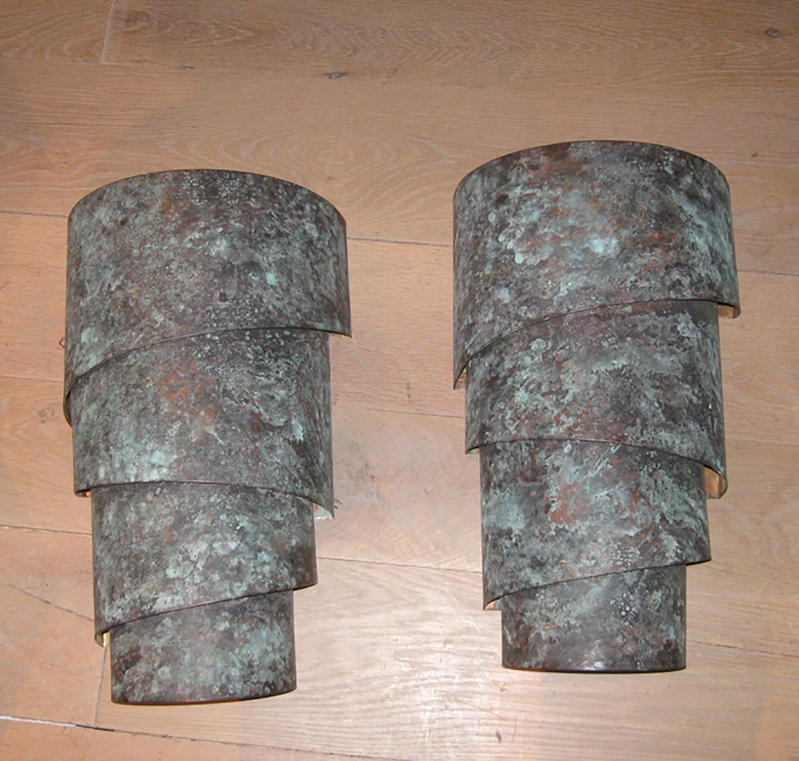 Pair of 20th century copper oxidized sconces. Great movement
New wiring.