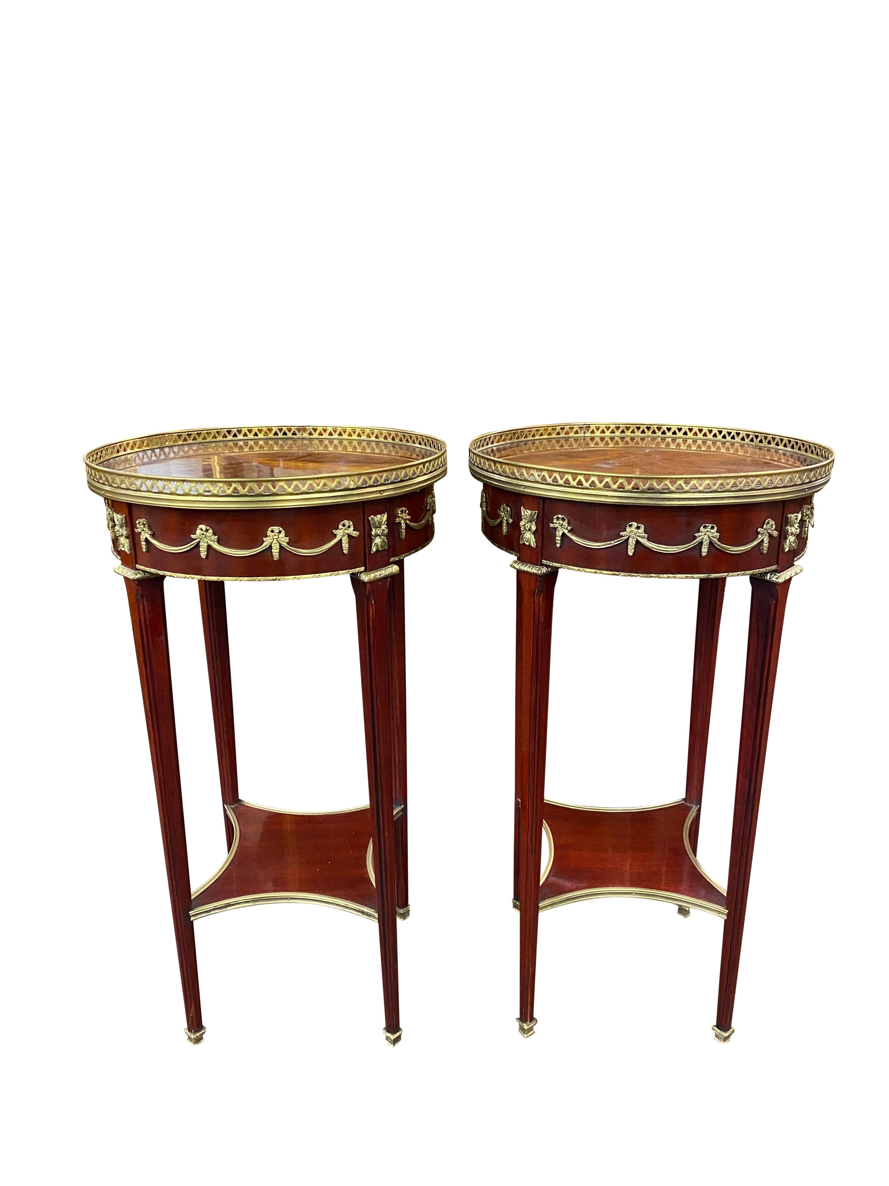 A stunning Pair of 20th Century Empire style side tables. A gorgeous and elegant design perfect for modern interiors.