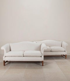 Pair of 20th Century English Camel Back Sofas