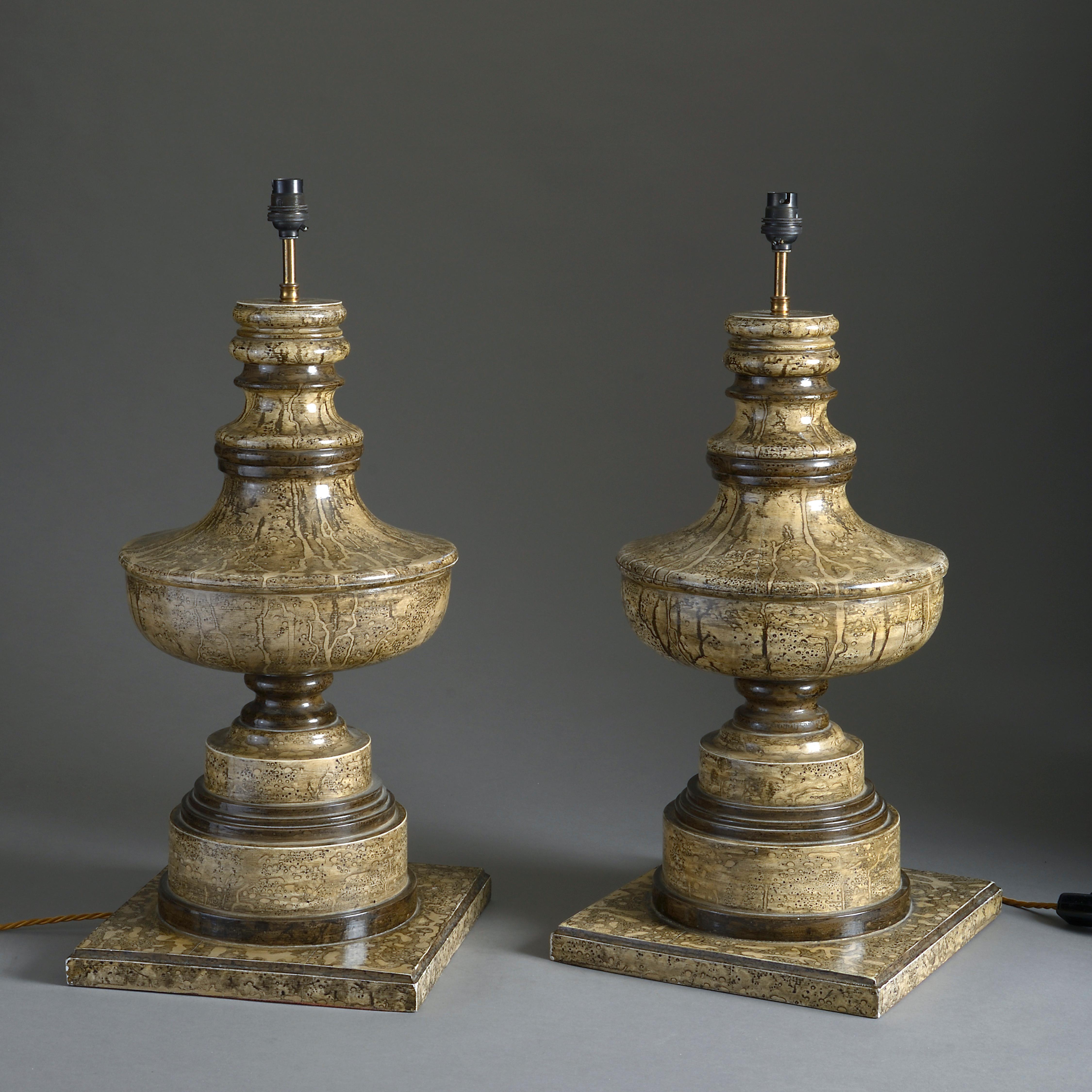 A pair of impressive mid-20th century faux marble painted turned wooden table lamps, of baroque baluster form with square plinth bases.

Height refers to antique parts only (not including electrical components).

All lighting products tested to