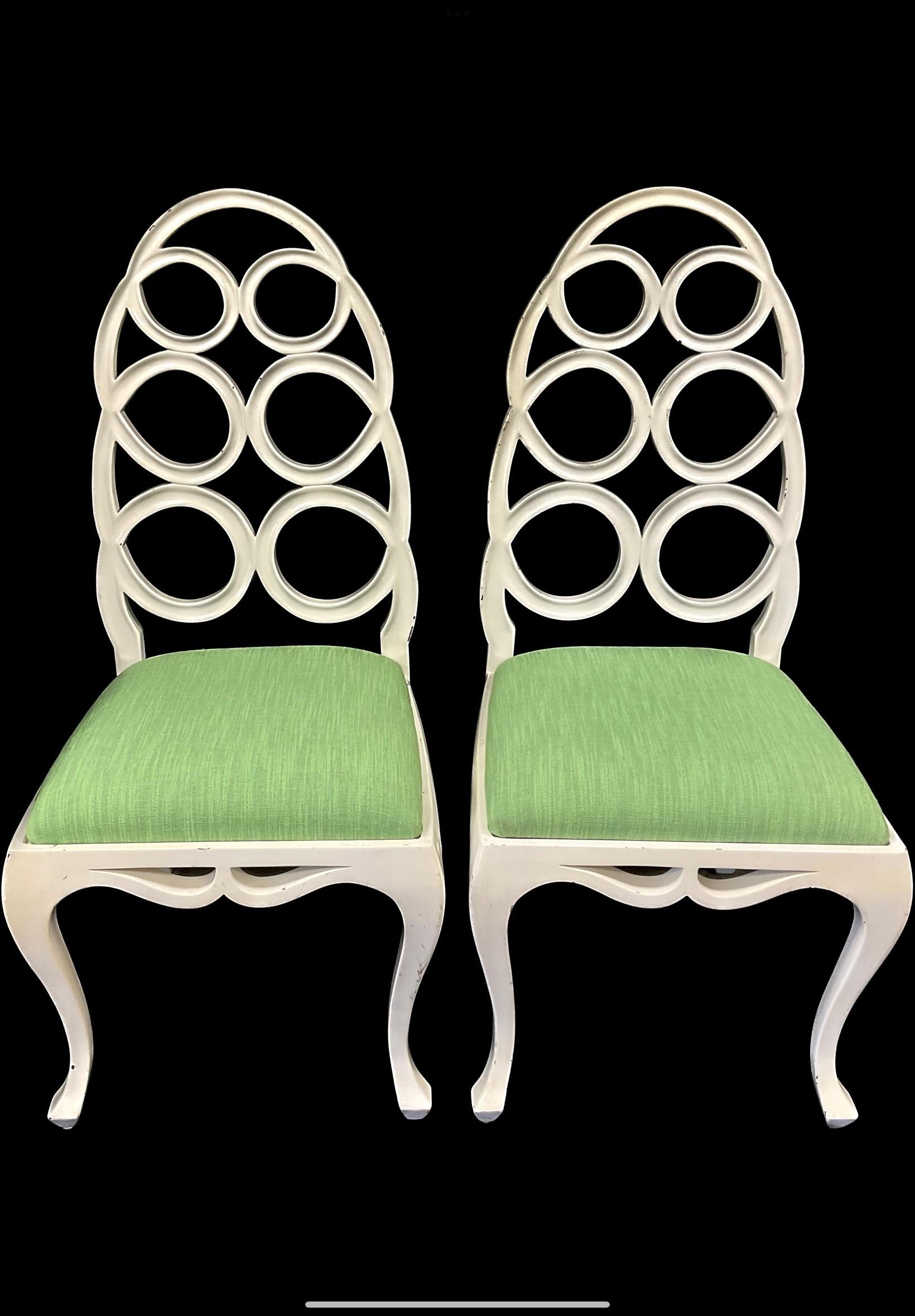 Handsome pair of 'Loop' side chairs in the Francis Elkins style. They are based on Elkins' iconic 1930's styles. Chairs feature a designer favorite  ribbon loop style. The matte white finish is contrasted with rich green cotton seats. 