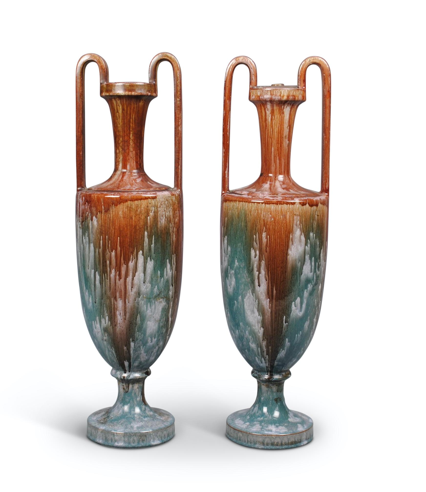 A fine pair of early 20th century, probably French, ceramic amphora shaped vases, with wonderful drip glaze and craquellure decoration.
