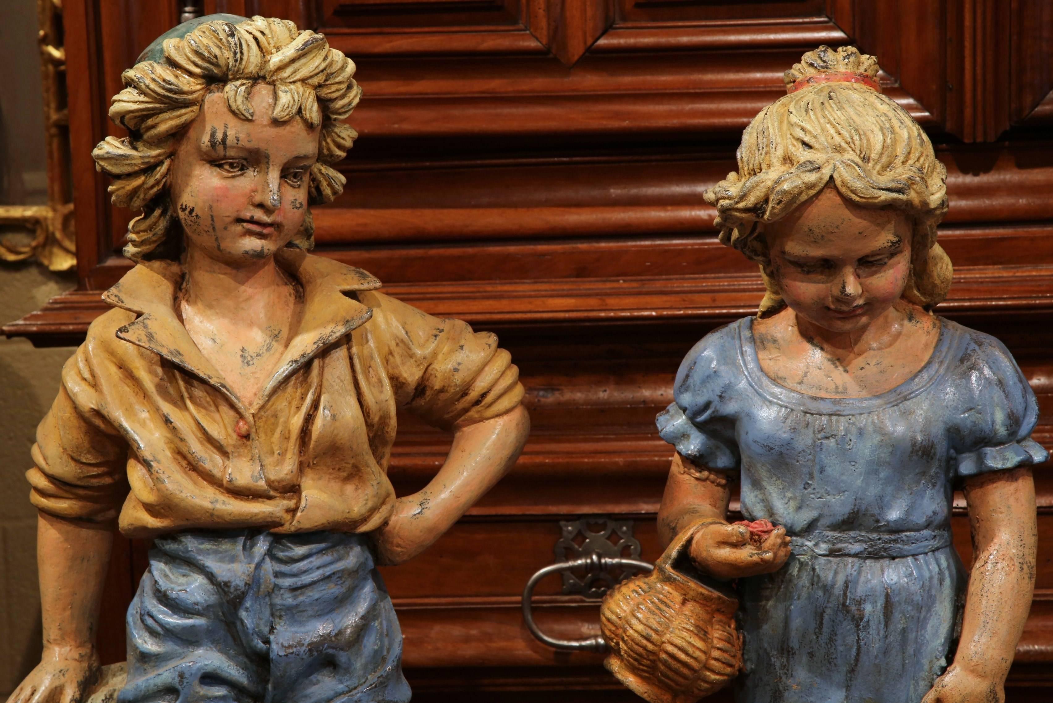 Hand-Crafted Pair of 20th Century French Hand Painted Iron Boy and Girl Sculptures For Sale