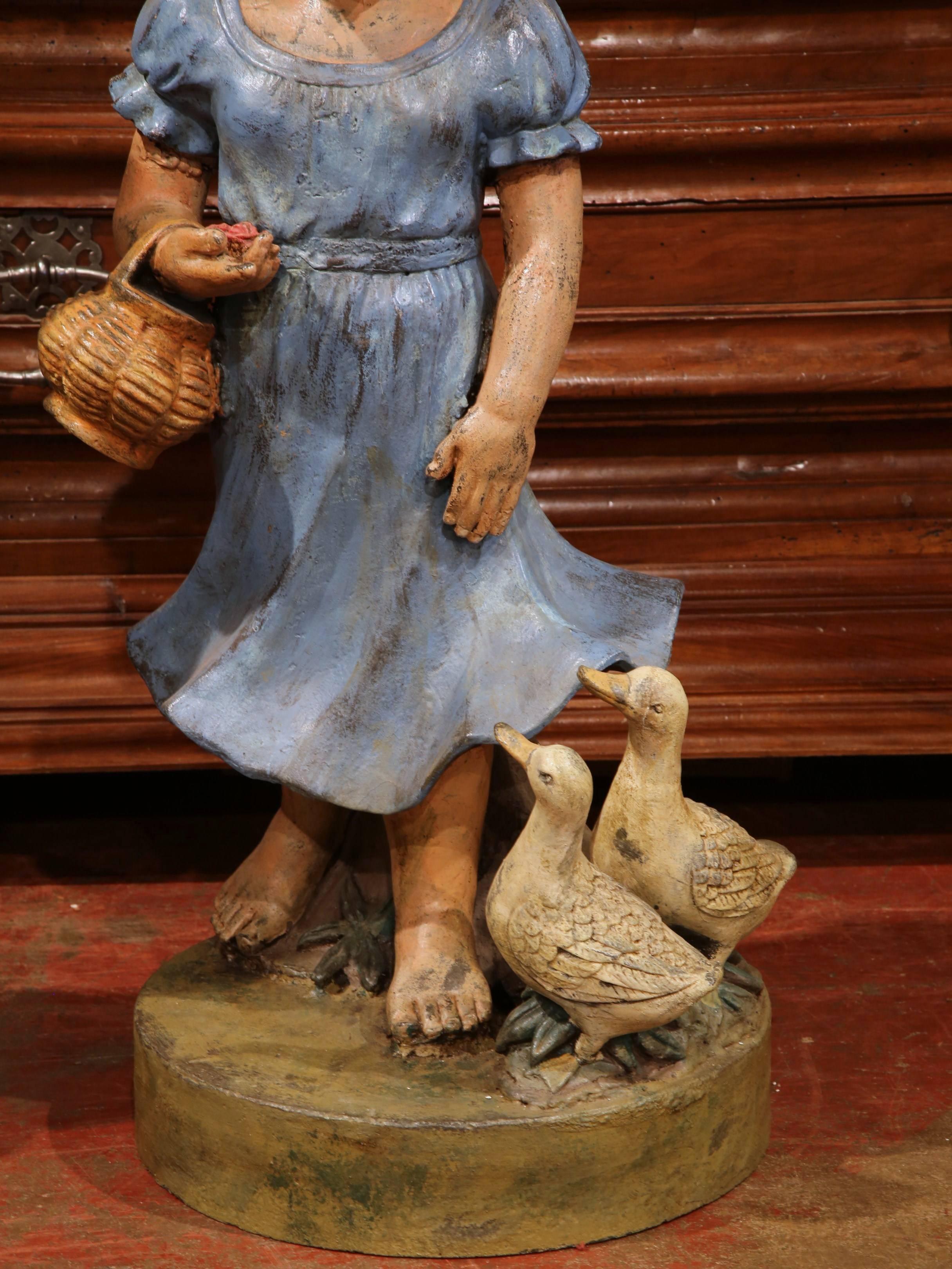 Pair of 20th Century French Hand Painted Iron Boy and Girl Sculptures In Excellent Condition For Sale In Dallas, TX