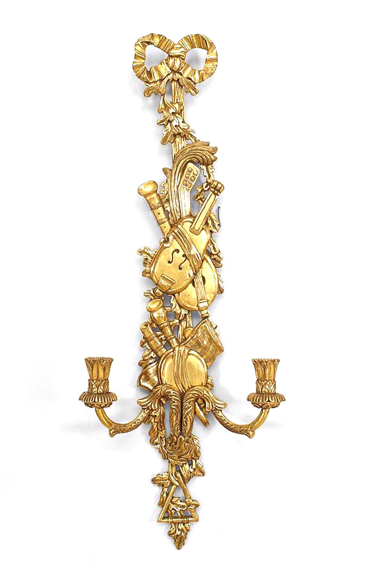 Pair of French Louis XV-Style gilt 2 arm wall sconces with carved design of musical instruments and bow knot top. (PRICED AS Pair)
