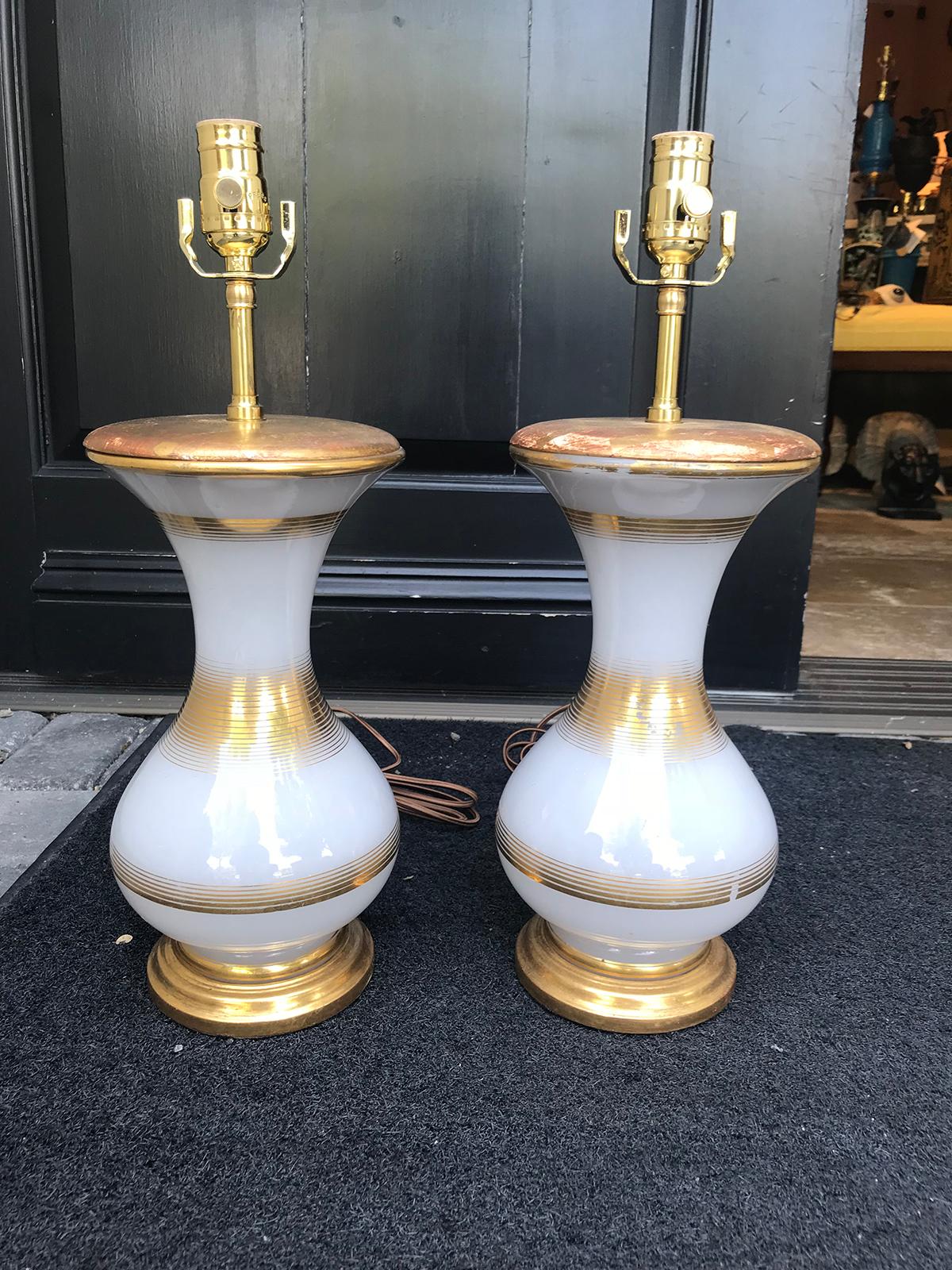 Pair of 20th century French white and gold opaline glass lamps on custom bases
New wiring
5.25