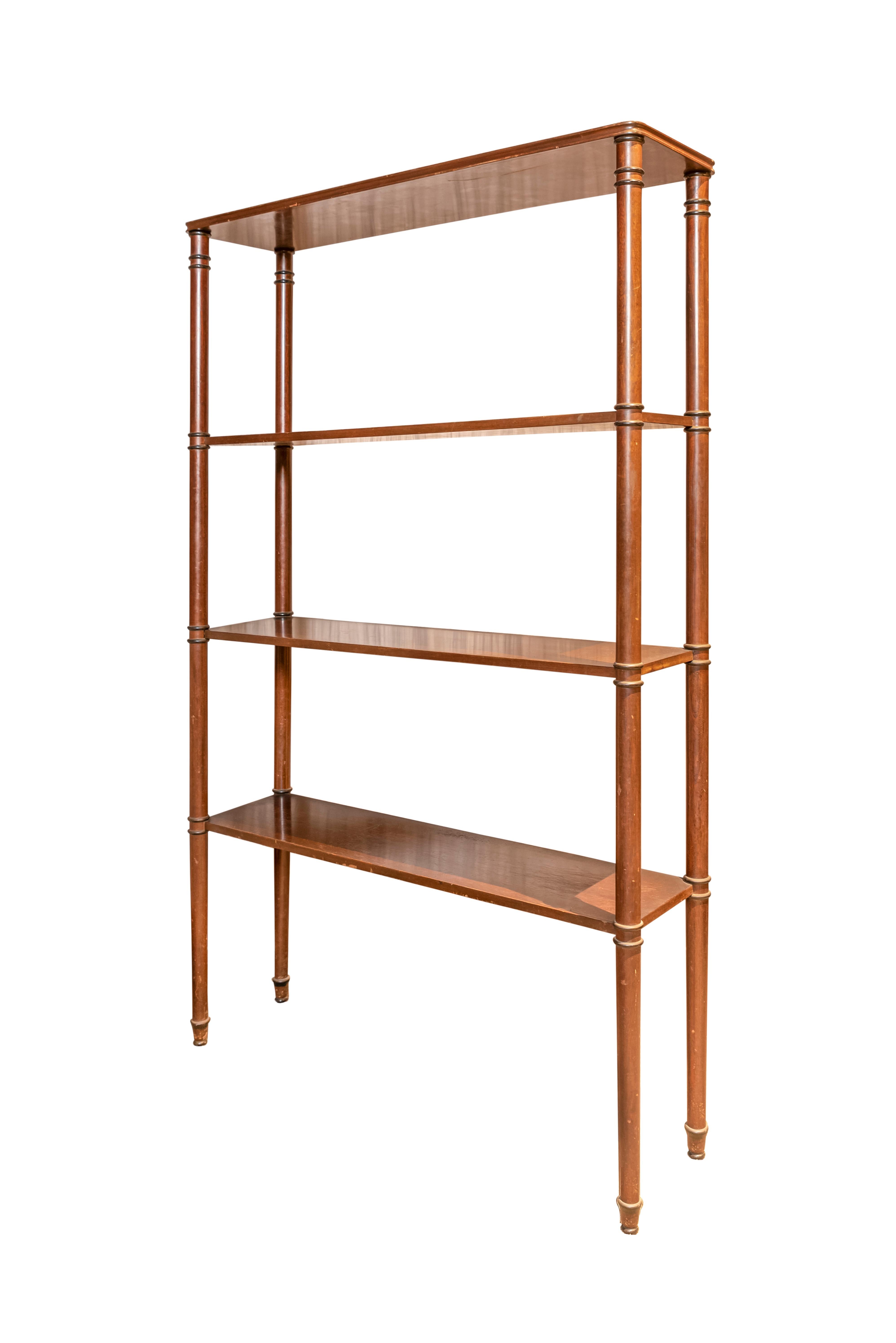 Pair of French wood four shelves open bookcase or four-tier étagère. In four column support detailed with black painted rings.
In the manner of Maison Jansen.