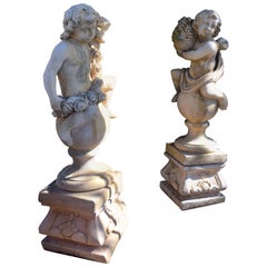 Pair of 20th Century Garden Cherubs on Square Plinths