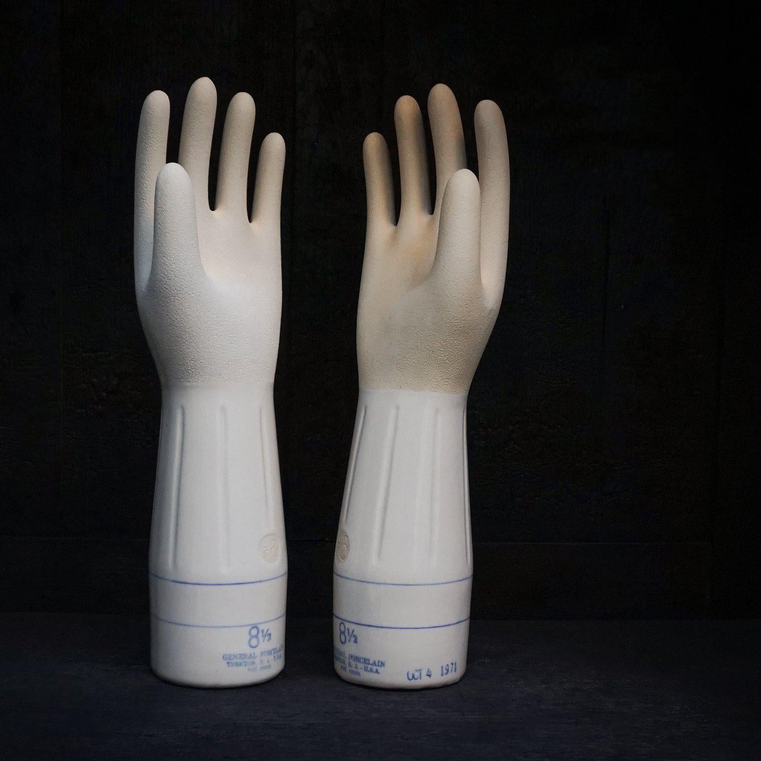 Very unique and exceptionally cool vintage set of left and right Industrial porcelain factory glove forms or moulds in size 8 1/2. 

Visible maker markings, glove sizes and production dates at the bottom rim in blue. The left hand was made on
