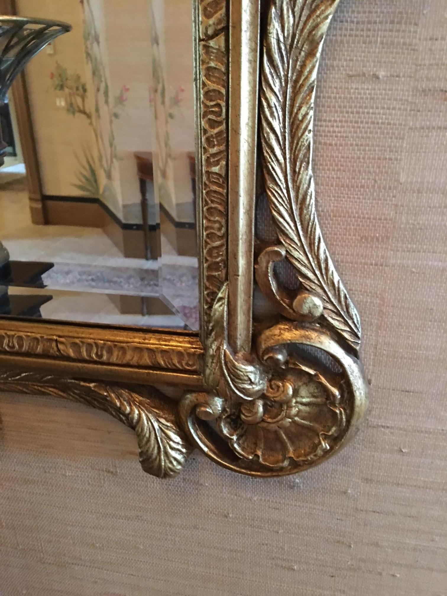 Pair of 20th century gilded Prince of Wales feather mirrors with beveled mirrors.