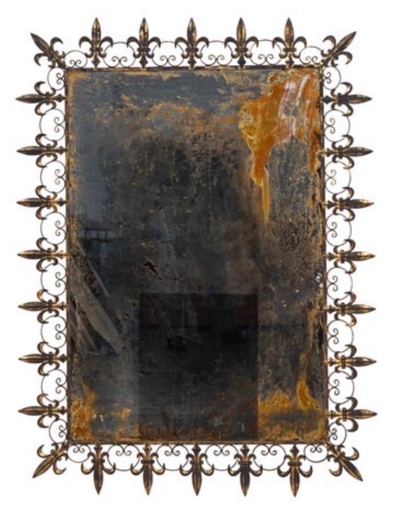 Pair of 20th century gilt metal fleur-de-lys mirrors. Great distressed colors in the mirrors