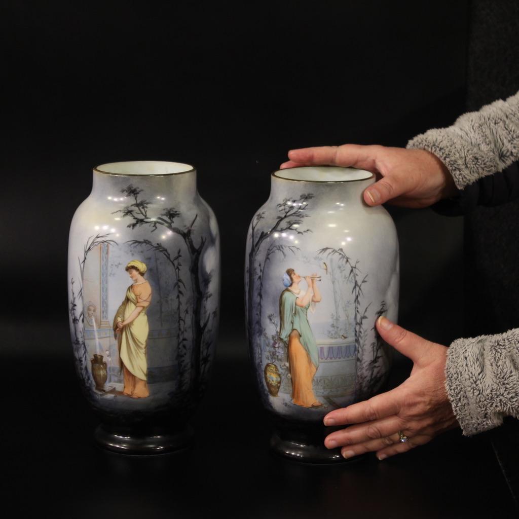 Pair of French vases from the early 20th century. Finely hand-painted opaline objects depicting views with girls in classic style of excellent quality. Beautifully sized vases and pleasant furnishings for antique dealers, interior designers and