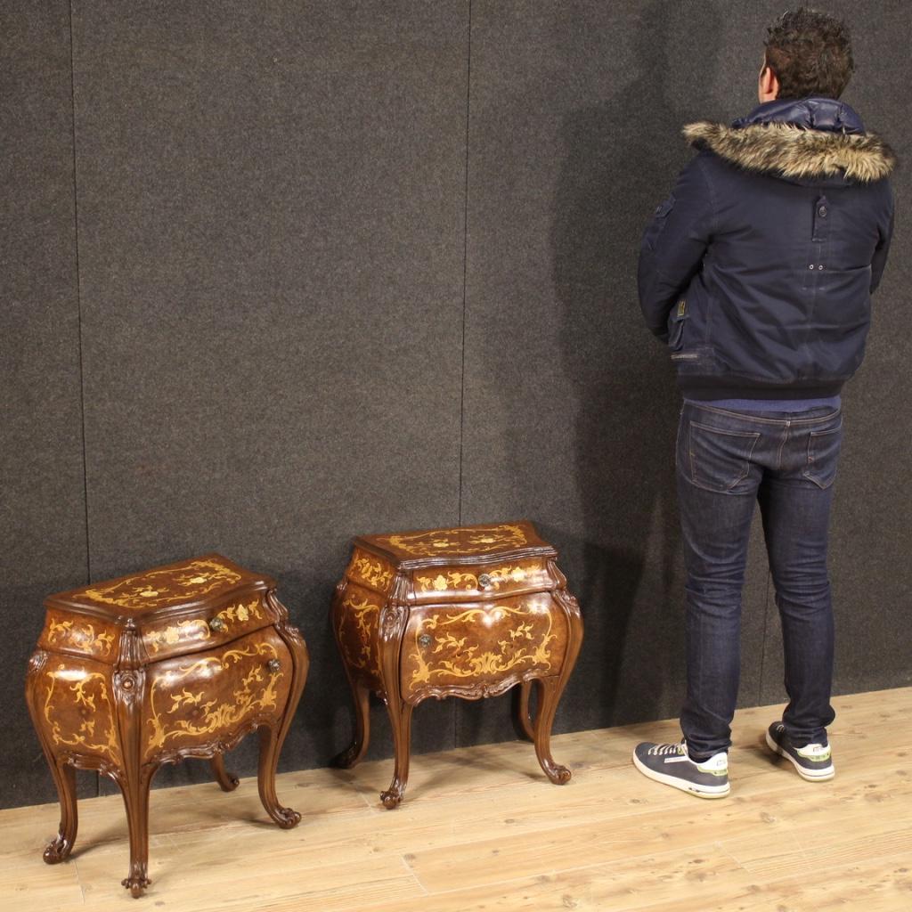 Pair of Italian bedside tables from the 20th century. Moved and rounded furniture pleasantly inlaid in burl, elm, beech, maple, fruitwood and faux ivory. Bedside tables equipped with a drawer, a front door and a wooden top in a character also inlaid