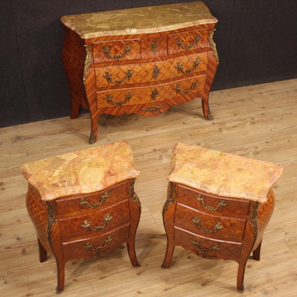 French bedside tables from 20th century. Moved and rounded furniture richly adorned with geometric inlay in wood of rosewood and walnut. Bedside tables decorated with finely gilded and chiseled bronze handles (see photo), equipped with three