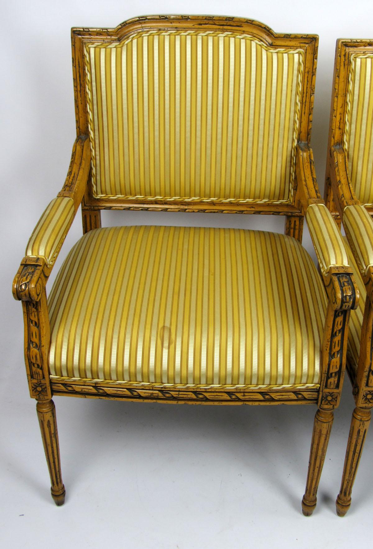 Pair of 20th century Italian armchairs in a striped yellow and gold fabric.