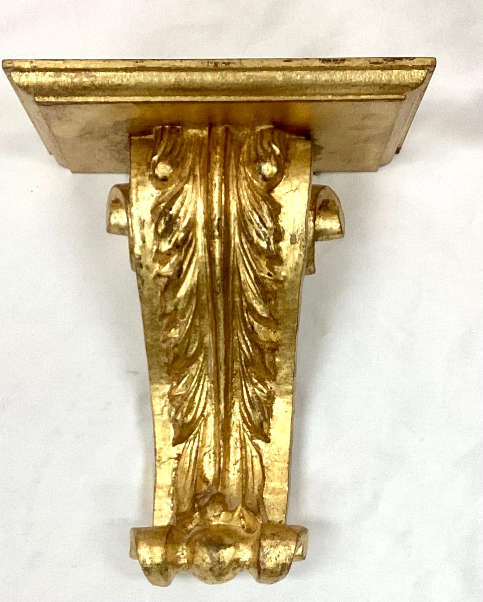 Pair of 20th Century Italian gilt wood wall brackets. Great for displaying decorative objects or fabulous on their own. Marked 
