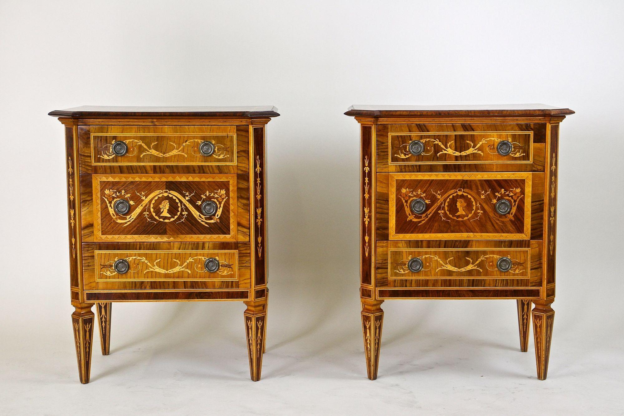 Extraordinary pair of petite Italian Marquetry pillar commodes/ side tables from the early 20th century around 1930. These artfully shaped commodes were elaborately handmade after the renowned model created by the famous Italian cabinet maker