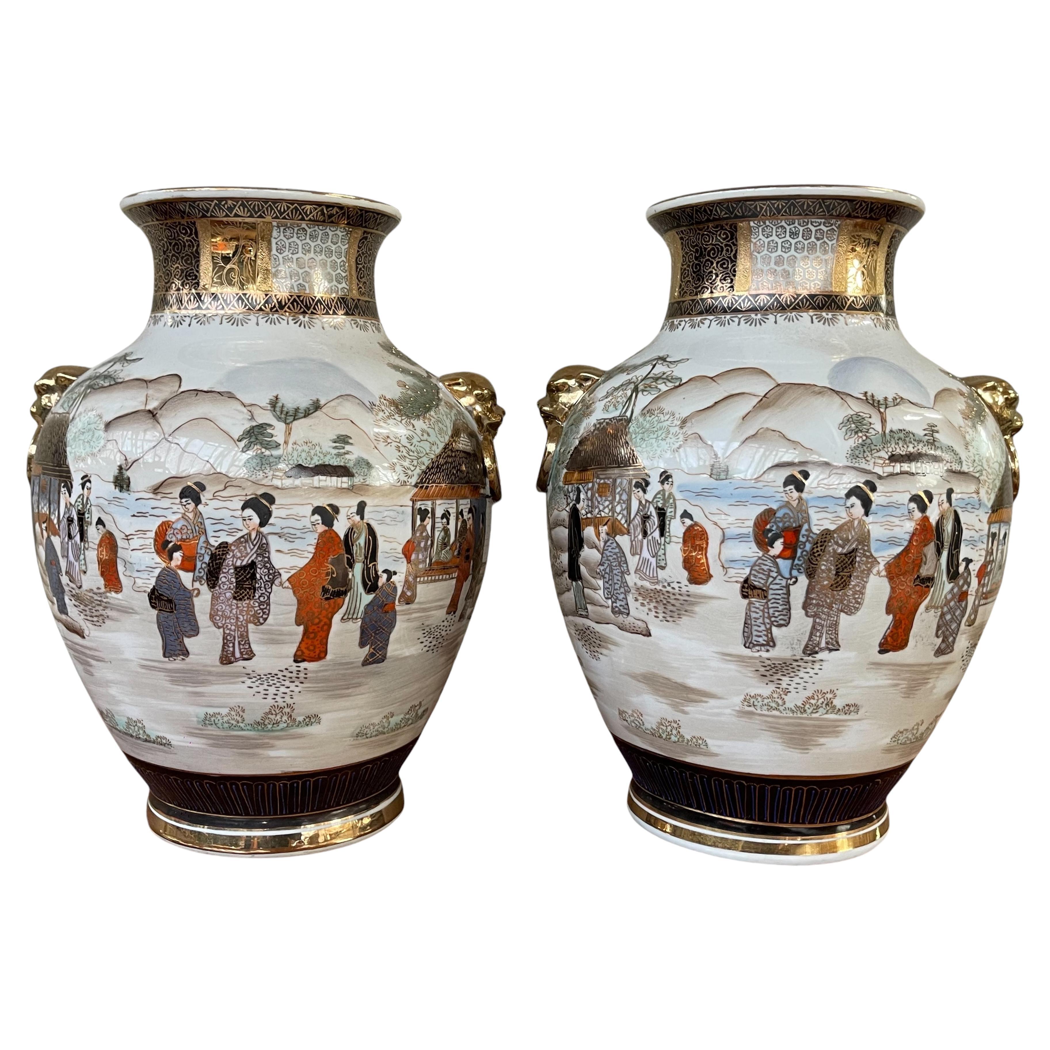 Pair of 20th Century Japanese Satsuma Vases with gilded lion head accents