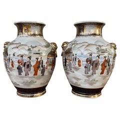 Pair of 20th Century Japanese Satsuma Vases with gilded lion head accents