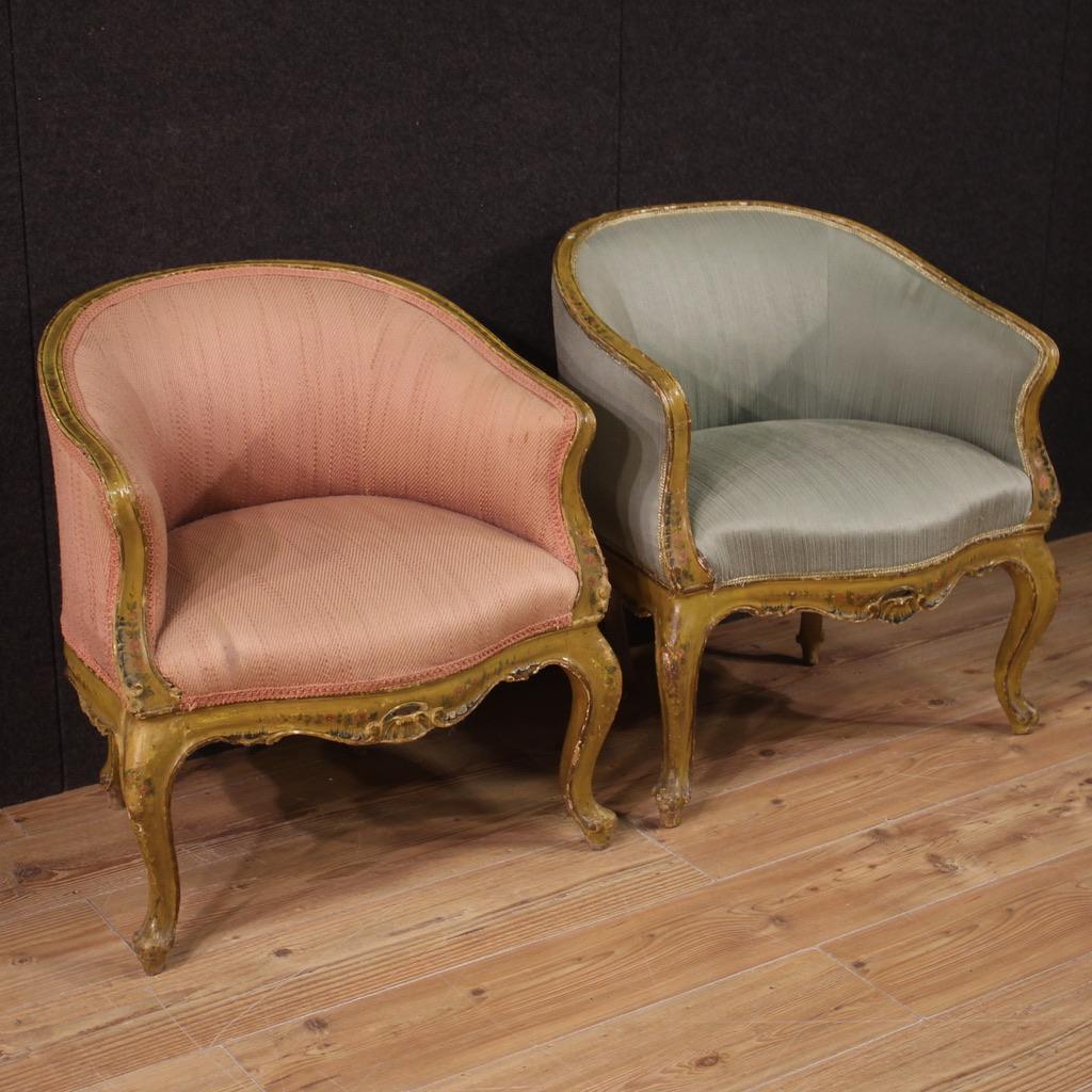 Pair of Venetian armchairs from the mid-20th century. Furniture in carved, lacquered and hand painted wood with very pleasant floral decorations. Armchairs upholstered in fabric with different colors (see photo). Fabric with small spots and signs of