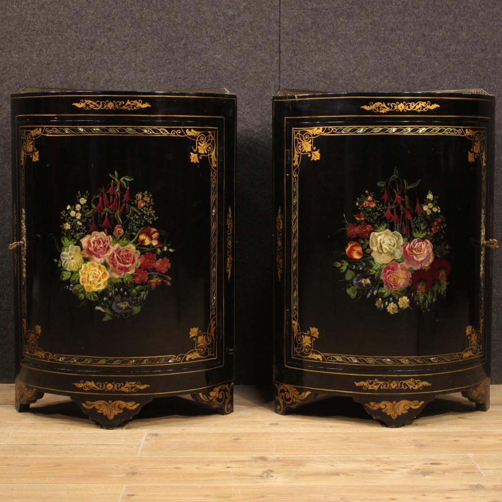 Pair of French corner cabinets from the mid-20th century. Furniture in lacquered and hand-painted wood with decorations applied in imitation mother of pearl. Finely painted corner cupboards with floral ornaments on doors and top. Top equipped with