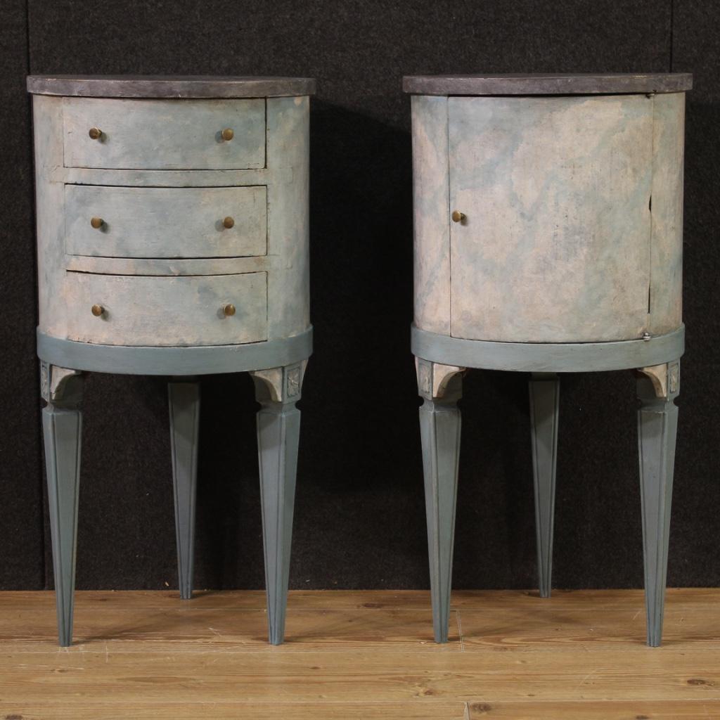 Pair of Italian bedside tables from the 20th century. Cylindrical furniture in carved, painted and lacquered faux marble wood of fabulous furnishings. Bedside tables of the same size, one complete with three drawers and the other with a door (see