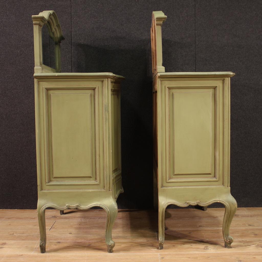 Pair of sideboards with shelf, Italy, mid-20th century. Furniture rounded on the front and straight on the sides, in carved and lacquered wood, of beautiful lines and pleasant decor. Sideboards with two doors of good capacity, equipped with a wooden