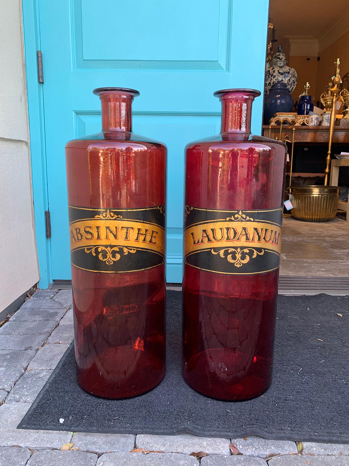 Pair of 20th century large red glass apothecary jars
Labeled Absinthe and Laudanum.