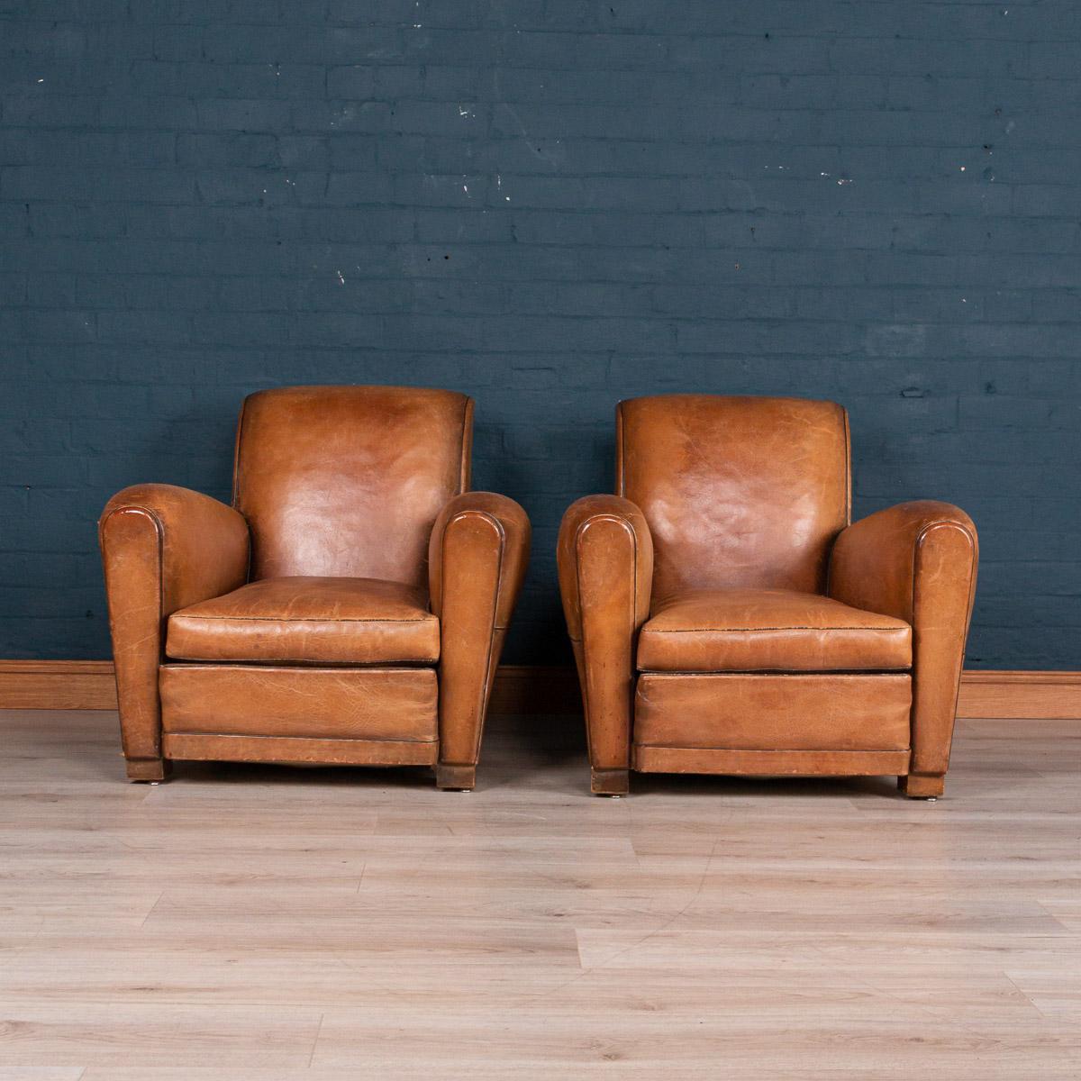 Gorgeous pair of French 20th century leather club chairs, circa 1930. Structurally sound, these chairs have been restored to their former glory and perennially ooze class and sophistication. Extremely comfortable, they suit any style of