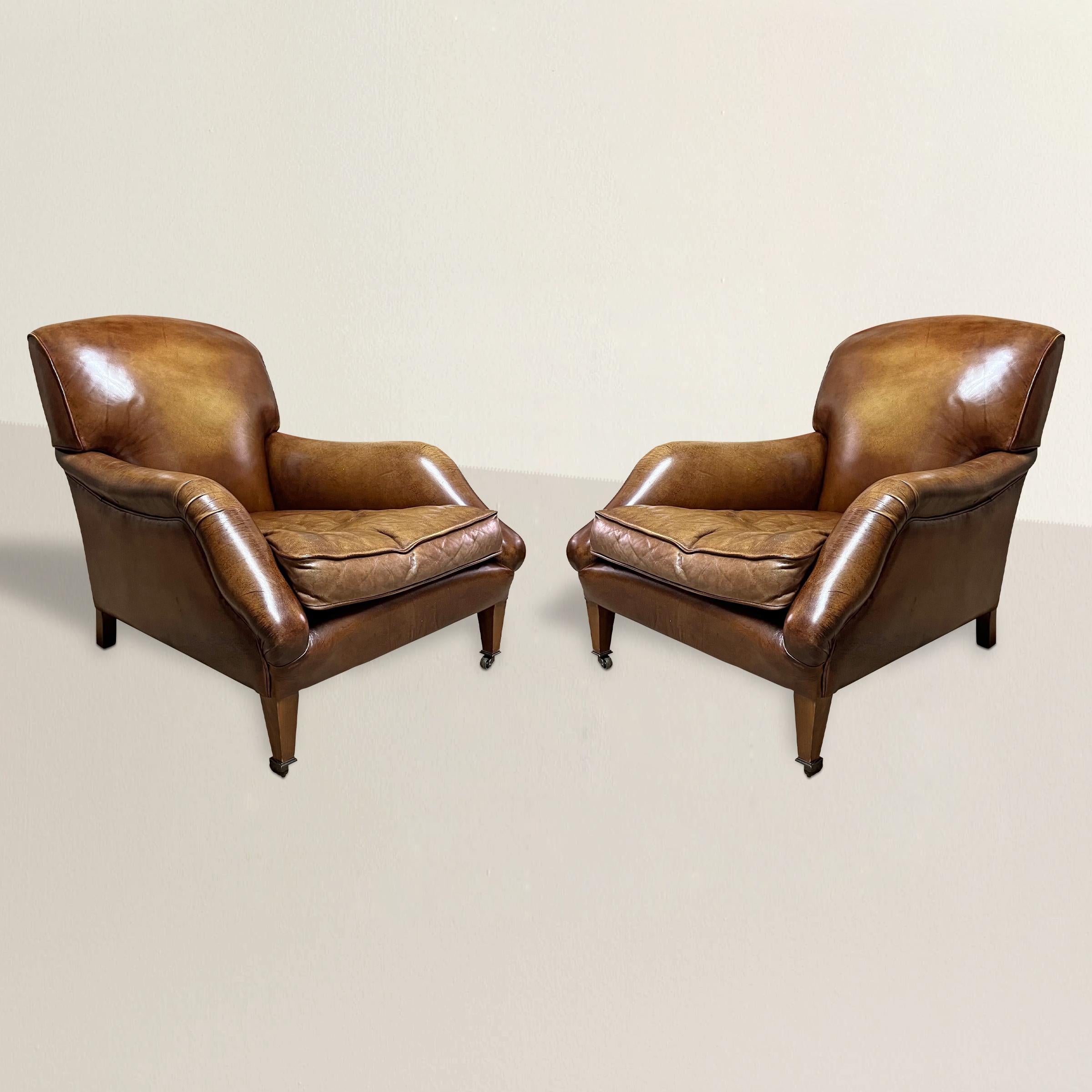 Indulge in the timeless sophistication of these exquisite 20th century leather club chairs, inspired by the English country house style synonymous with Howards & Sons. Adorned with gracefully rolled arms and supported by square tapered legs