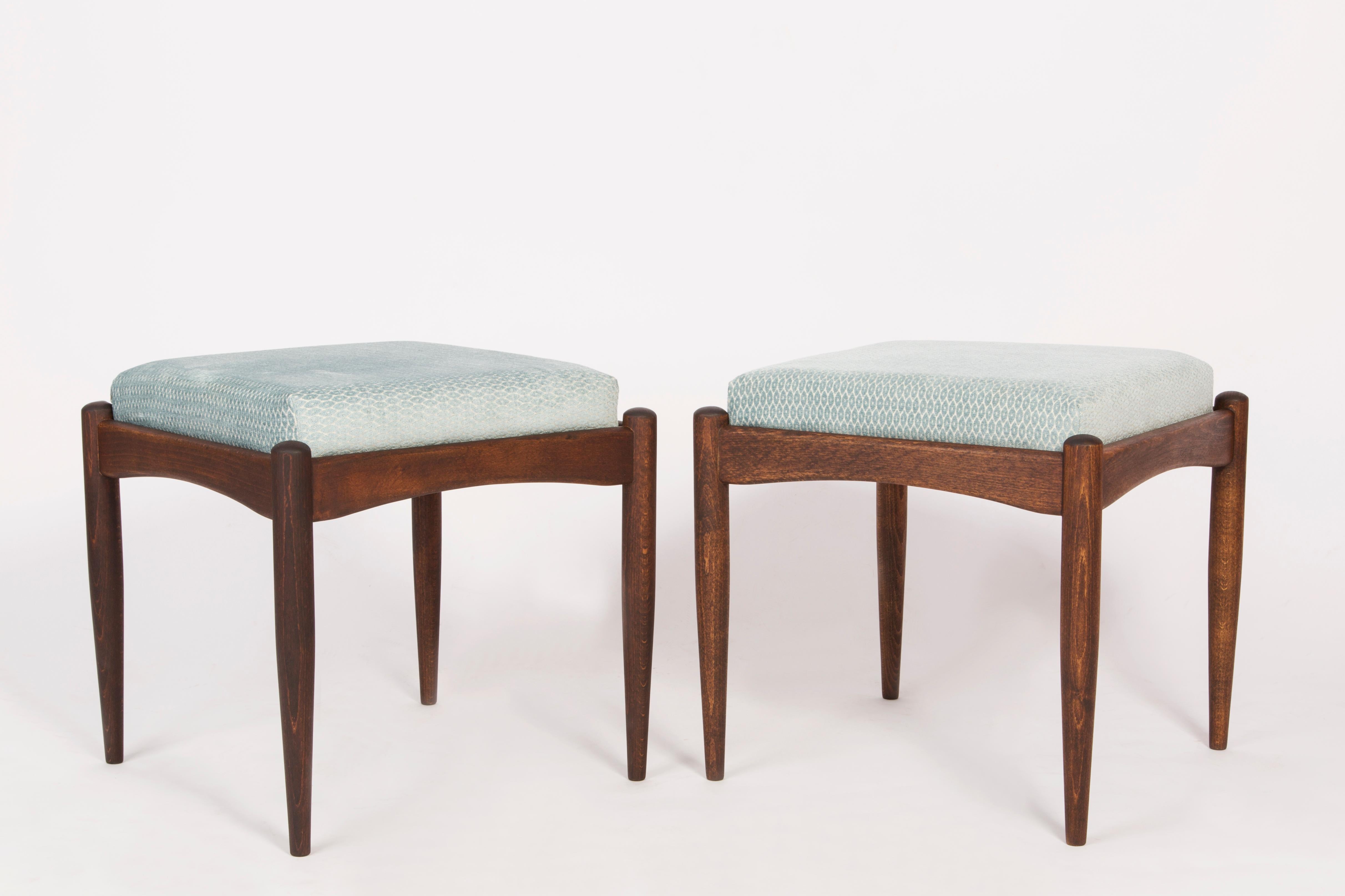 Stools from the turn of the 1960s and 1970s. Beautiful velvet blue upholstery. The stools consists of an upholstered part, a seat and wooden legs narrowing downwards, characteristic of the 1960s style. We can prepare this pair also in another color